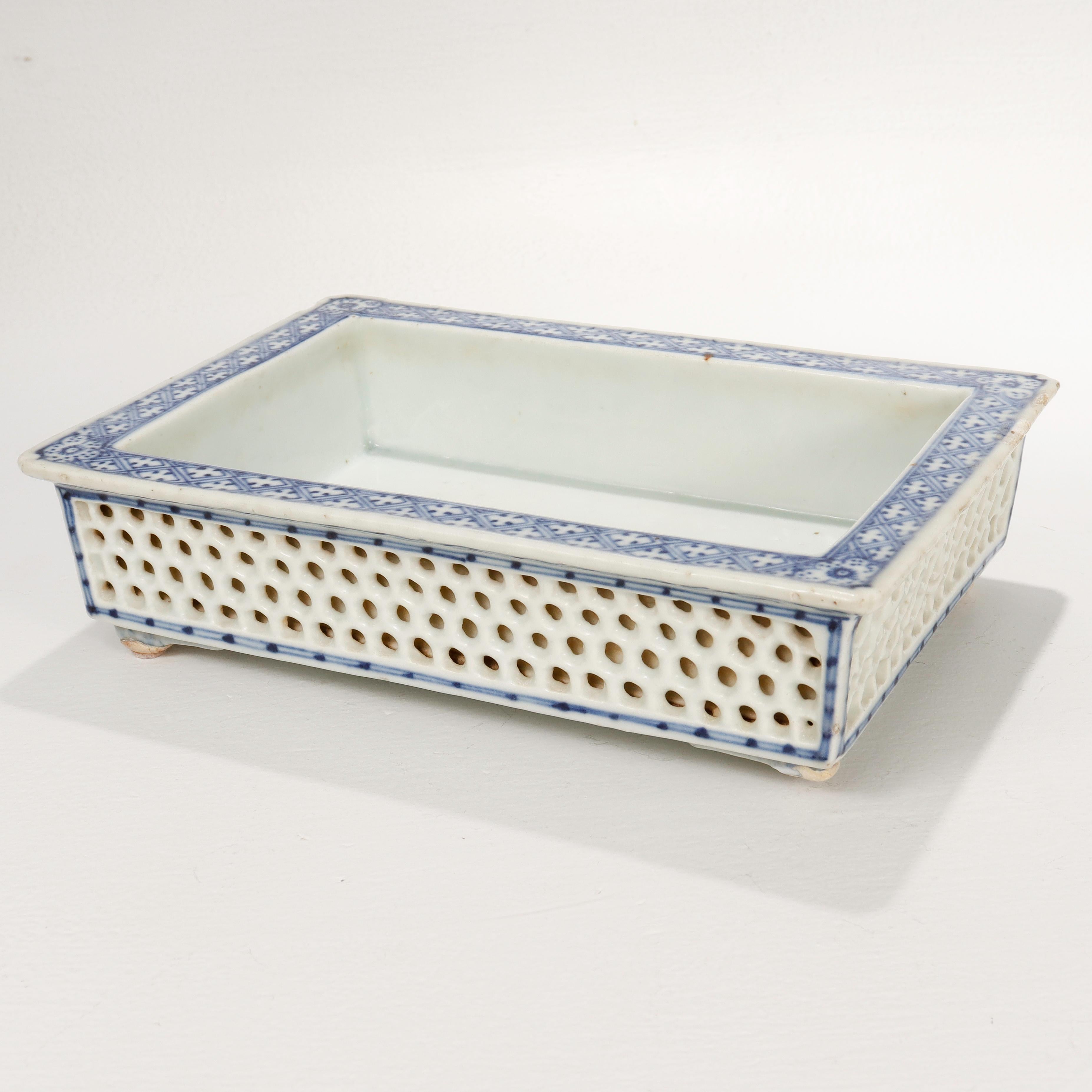 A fine old or antique double walled Chinese porcelain jardiniere.

With a wide blue & white decorated rim above honey comb lattice work double walled sides.

Supported by bracket feet.

Simply a wonderful Chinese porcelain planter or