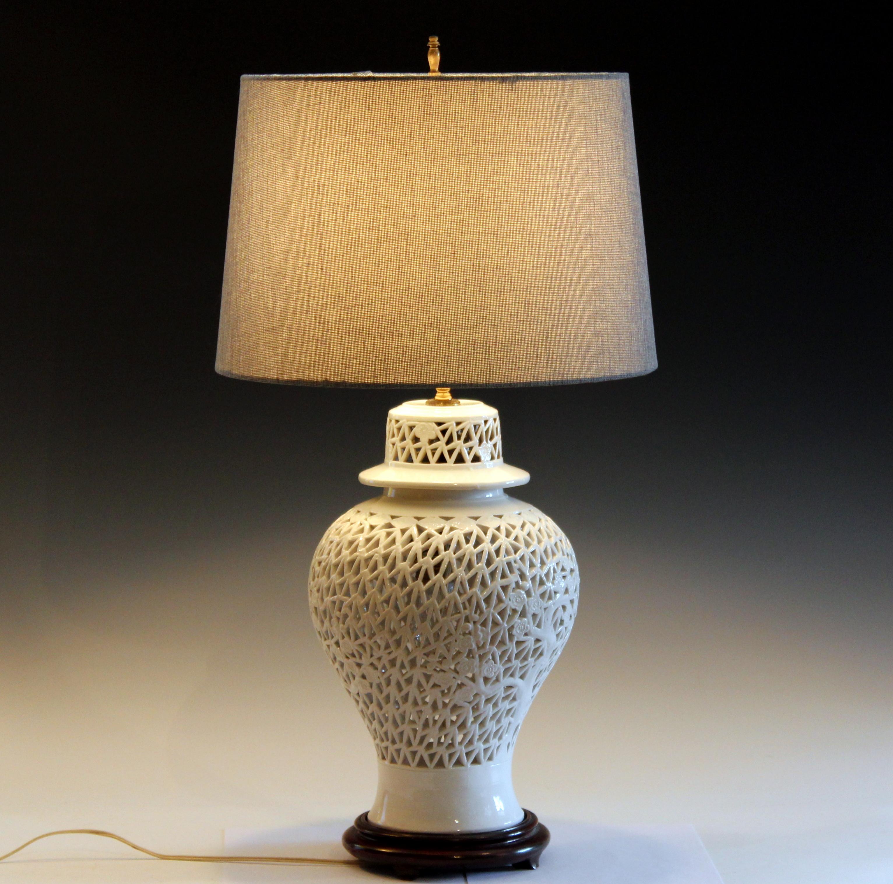 Large old Chinese porcelain carved Blanc de Chine lamp with inner bulb, circa early 20th century. Good design with finely carved openwork. 3 way switch. Measures: 28