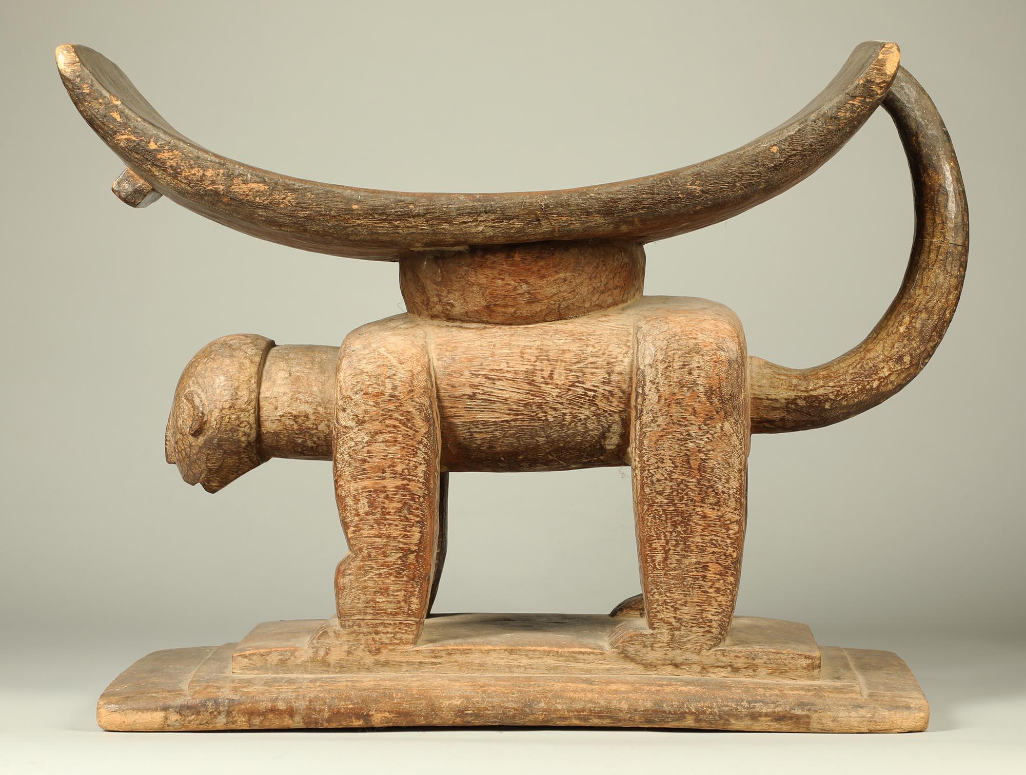 Created in the early to mid-20th century, by an anonymous artist of the Akan people of Ghana, probably Ashanti (Asante) or Fanti (Fante).
What separates this stool from the standard Akan stool or seat is the way the artist has used the wood grain to