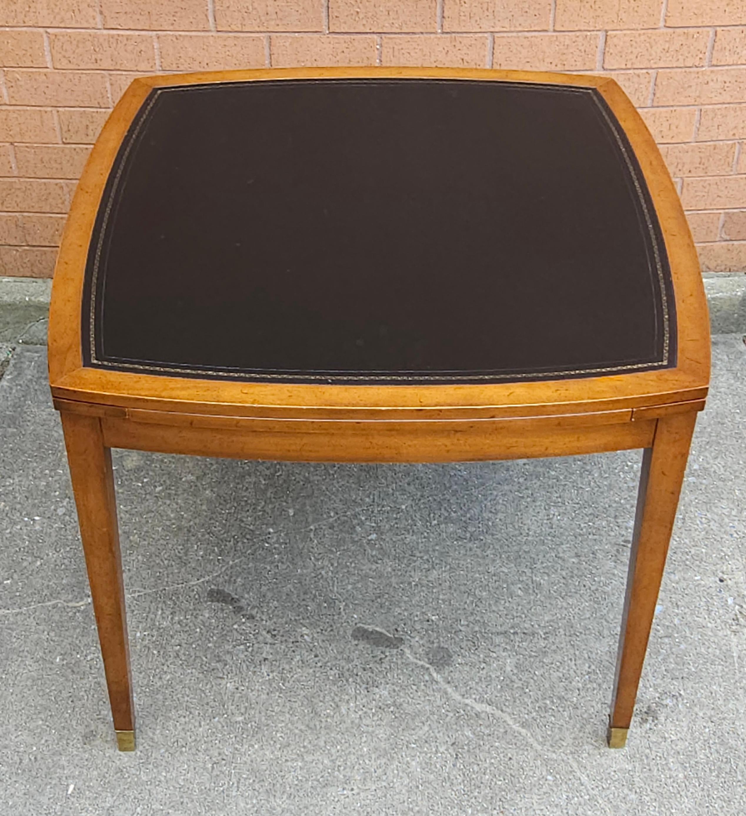  Beacon Hills Collection Walnut and Leather Games Table by Old Colony Furniture. Black tooled Leather surrounded by fine gold stenciling. Brass capped legs. 
Measures 33