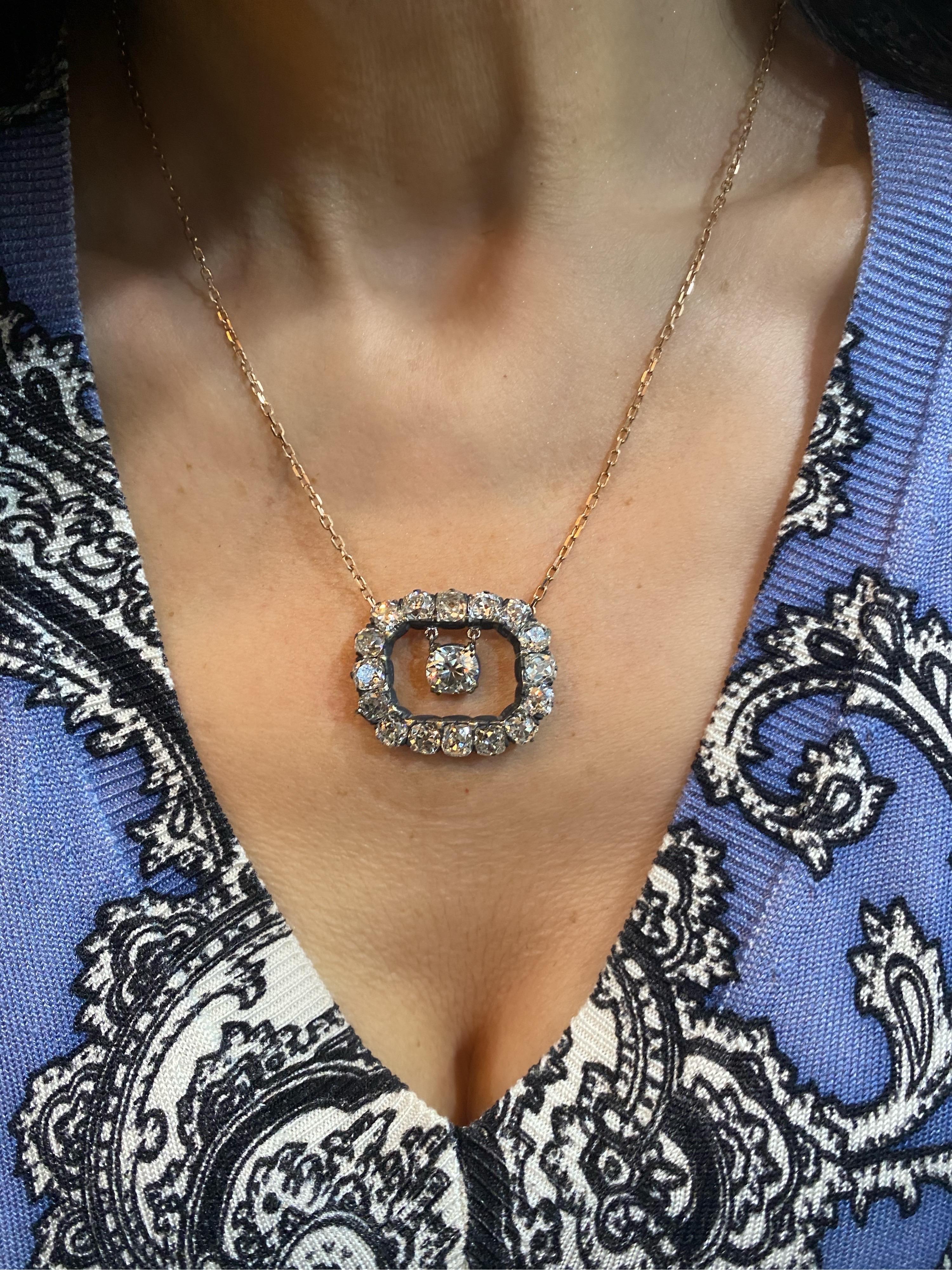 One- of-a-kind is our specialty! This incredible cushion cut necklace features a center 1.74 Carat GIA Certified Old mine Brilliant that dangles in center and an additional 10 Carat surrounding old cushion cut diamonds. Diamonds are set in blackened