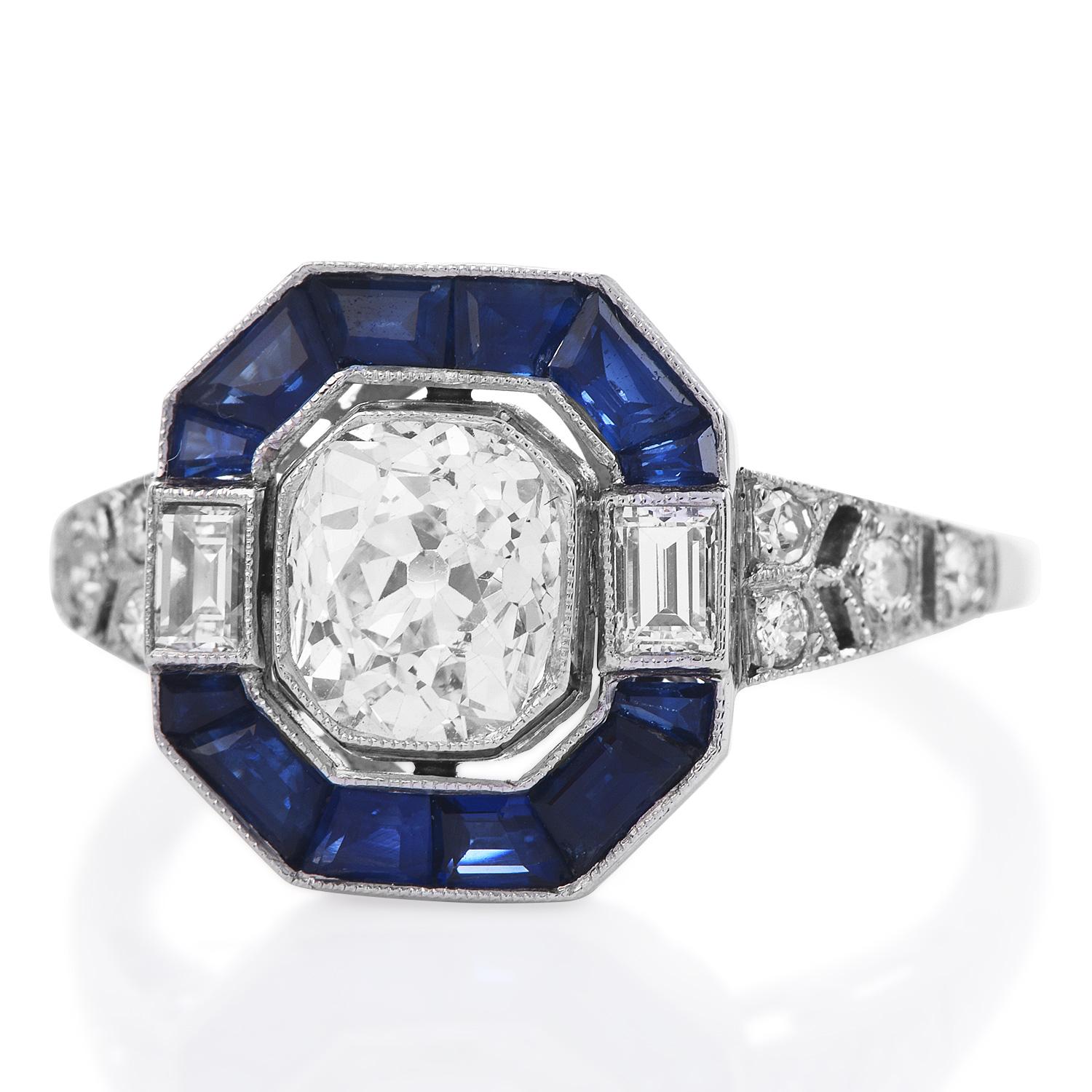 An octagonal-shaped top with a halo style geometrical design. 

This Ring is entirely made in platinum, with Diamonds and Blue Sapphire Art Deco design ring is centered with an old cushion cut diamond weighing approx. 1.07 carats, G-H  color,