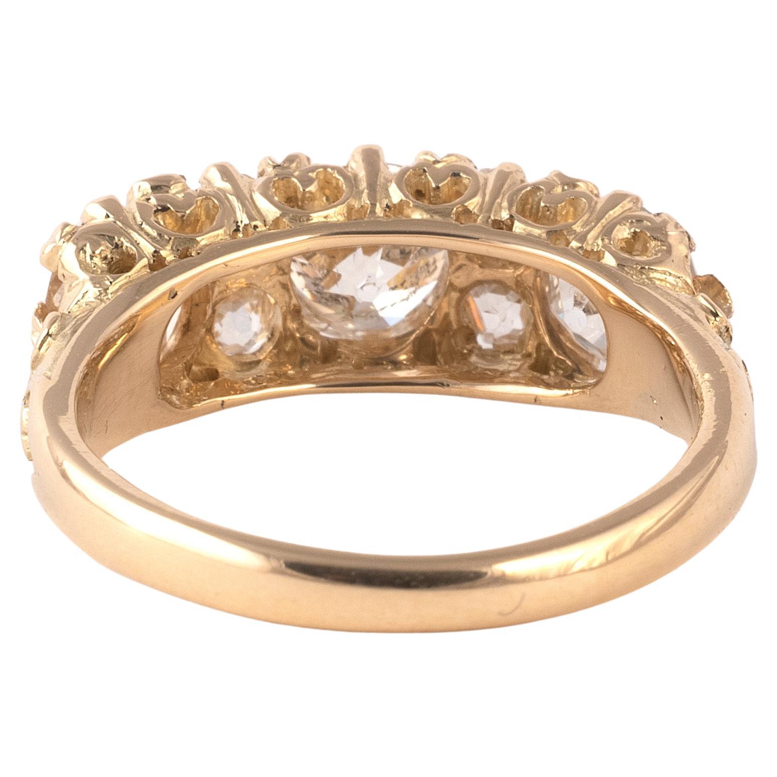 Old cushion cut diamond seven stone ring, set with three cushion cut diamonds approximately 2,5ct, each spaced with two old circular-cut diamonds in a scrolling gold mount. Size: 7
Weight:5gr.