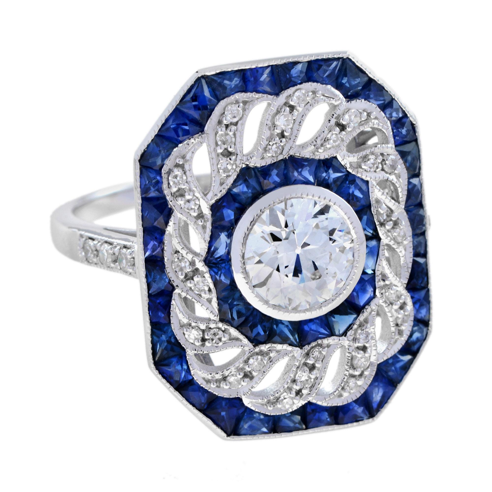 Wonderful and very special antique design ring, modeled in 18K White gold. It is decorated with a central 1.2 carat old cut diamond. The main stone is surrounded by a line of French cut blue sapphire and a twisted line of diamonds with another outer