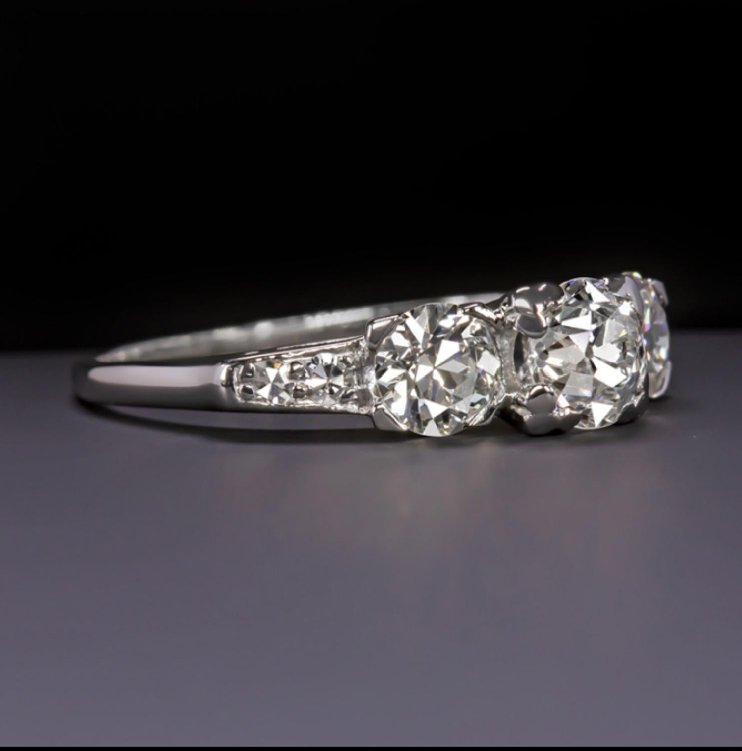 An amazing ring mounted by three old cut diamonds approx from 1920. The main stone weights 0.60 carats. The three stones are H in color and VS in clarity. A white faced trilogy with antique diamonds is something special and not very common.