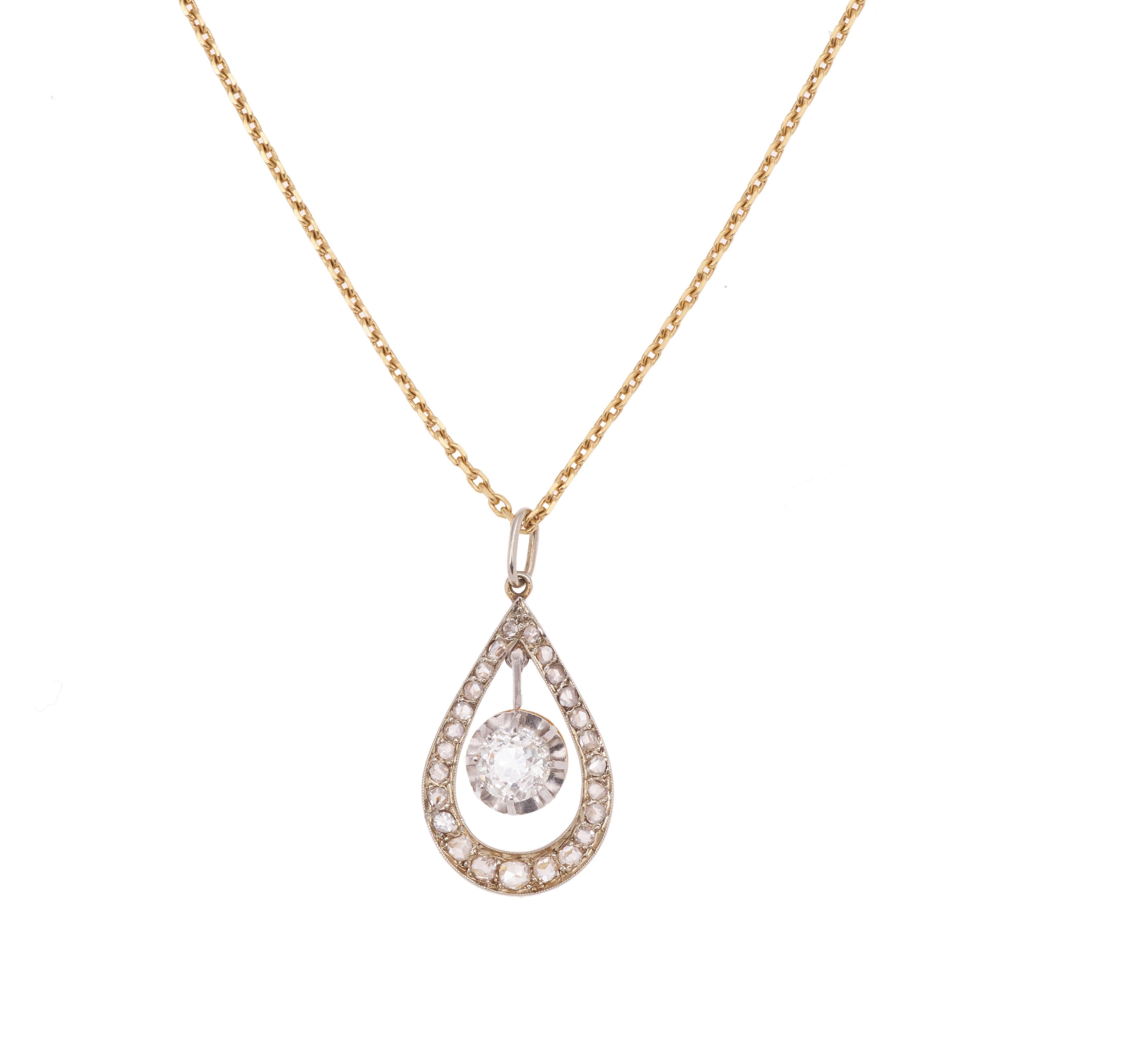 Beautiful platinum and yellow gold pendant paved with rose cut diamonds and set with a 0.50 carats old cut central diamond.

Weight of the central diamond: 0.50 carats
Color H/I
Clarity SI

Paving weight: 0.27 carats

Total diamond weight: 0.77