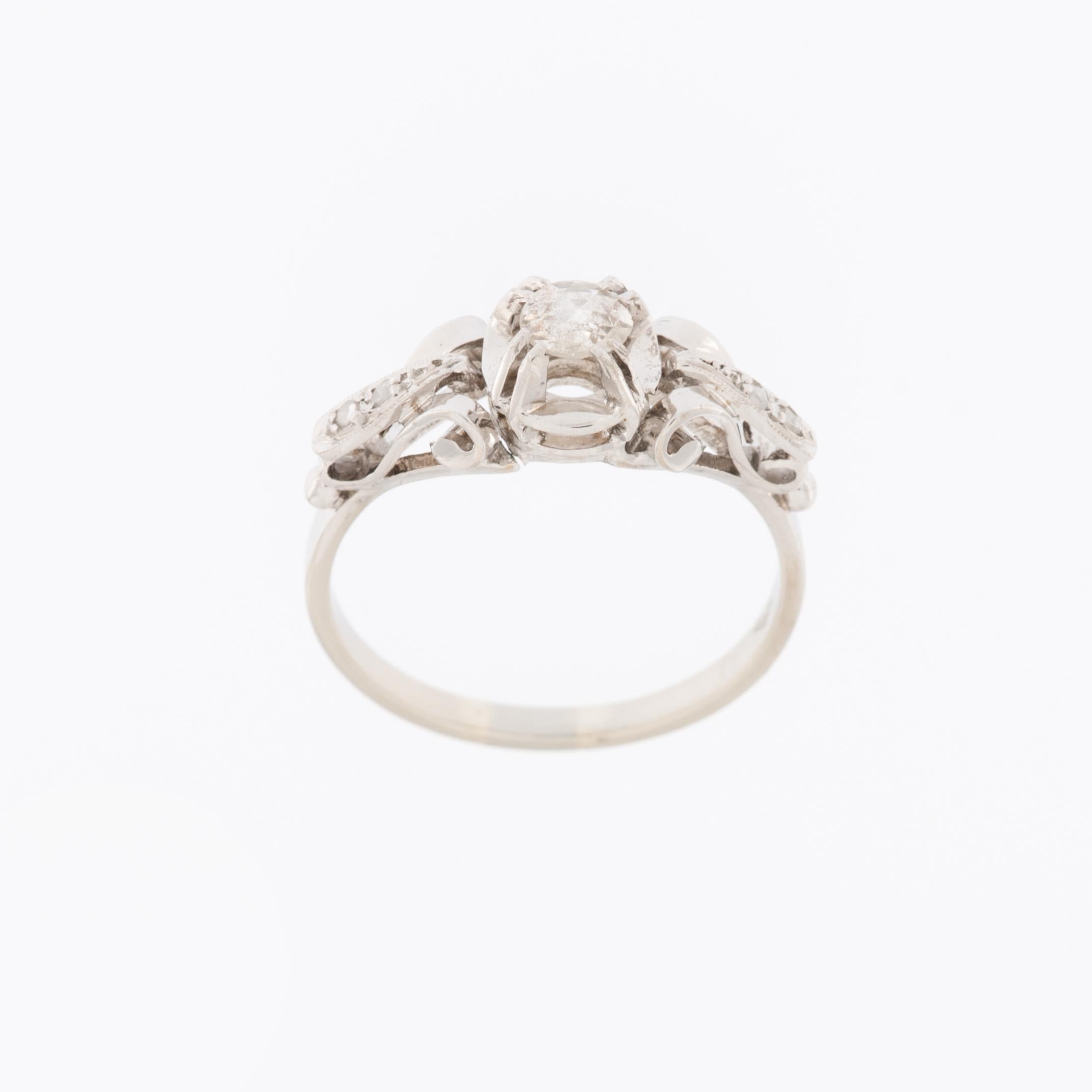 The Old Cut Diamonds 18kt White Gold Italian Engagement Ring is a stunning piece of jewelry that exudes timeless elegance and sophistication. The term 