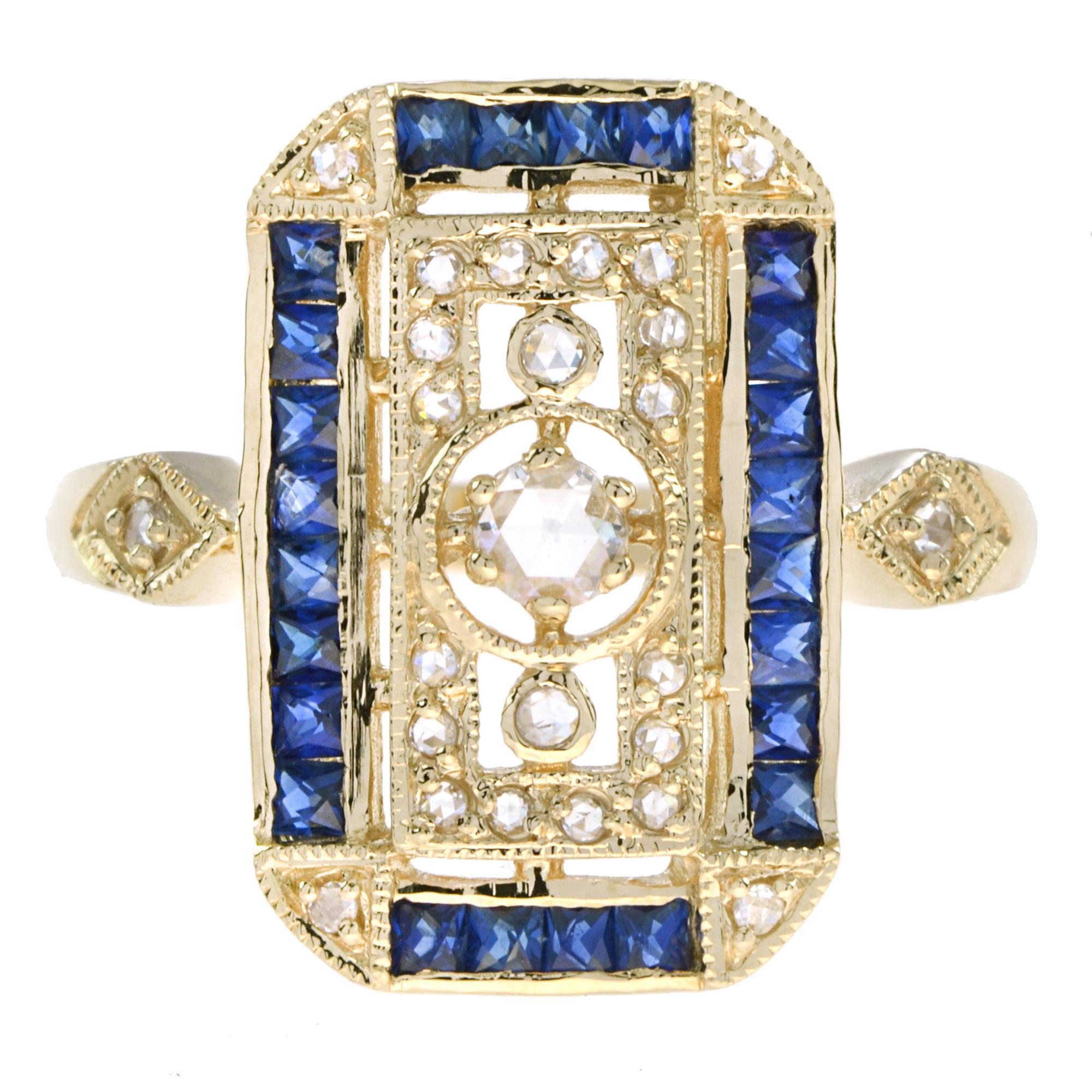 Stunning Antique inspired diamond and sapphire dinner ring. Bezel set in the center is an old cut diamond of approx. 0.10 carat. The outer columns are adorned with a beaded design. Framing the entire design are narrow French cut baguette shaped