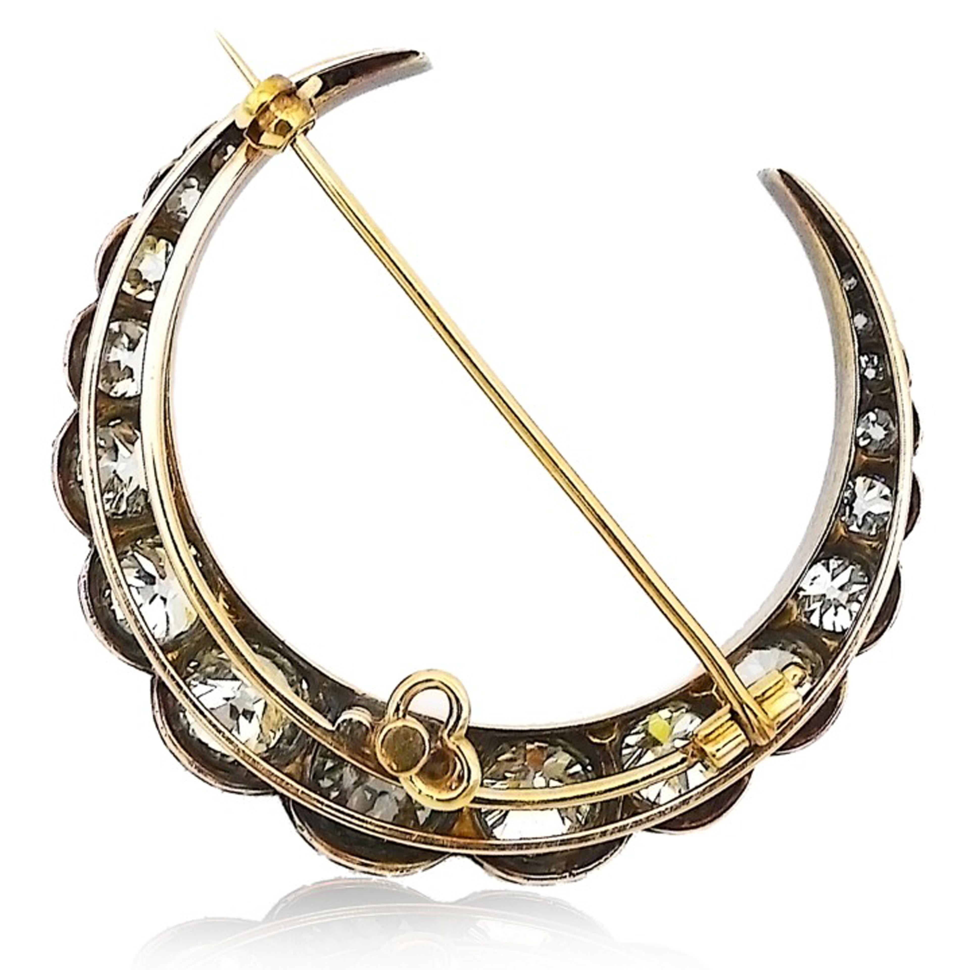 The Crescent Moon Shape Diamond Brooch Which has Around 10 Carats Of Old Cut Diamonds Beautifully Crafted in Silver and Gold.
The Diamonds Are Set in Silver and Gold, Commensurate With the Age and Tradition. The Back Of The Crescent Is Yellow Gold,