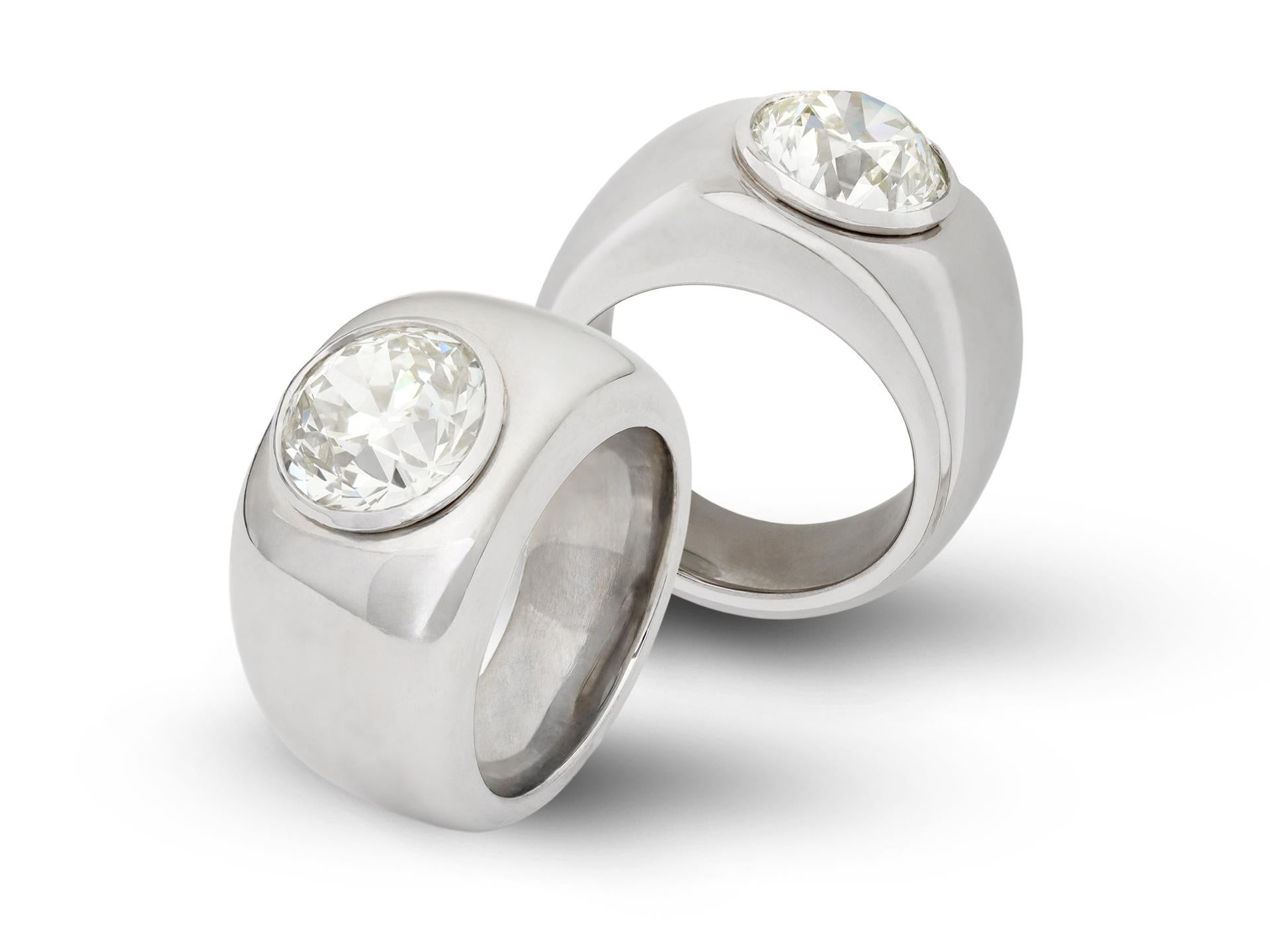 Old cut diamond gypsy ring. Set to centre with a round old cut diamond, U-V colour, VS1 clarity, with a weight of 4.22 carats in an open back rubover setting, to a solitaire design with curved solid bezel, polished borders and fancy open backholing,