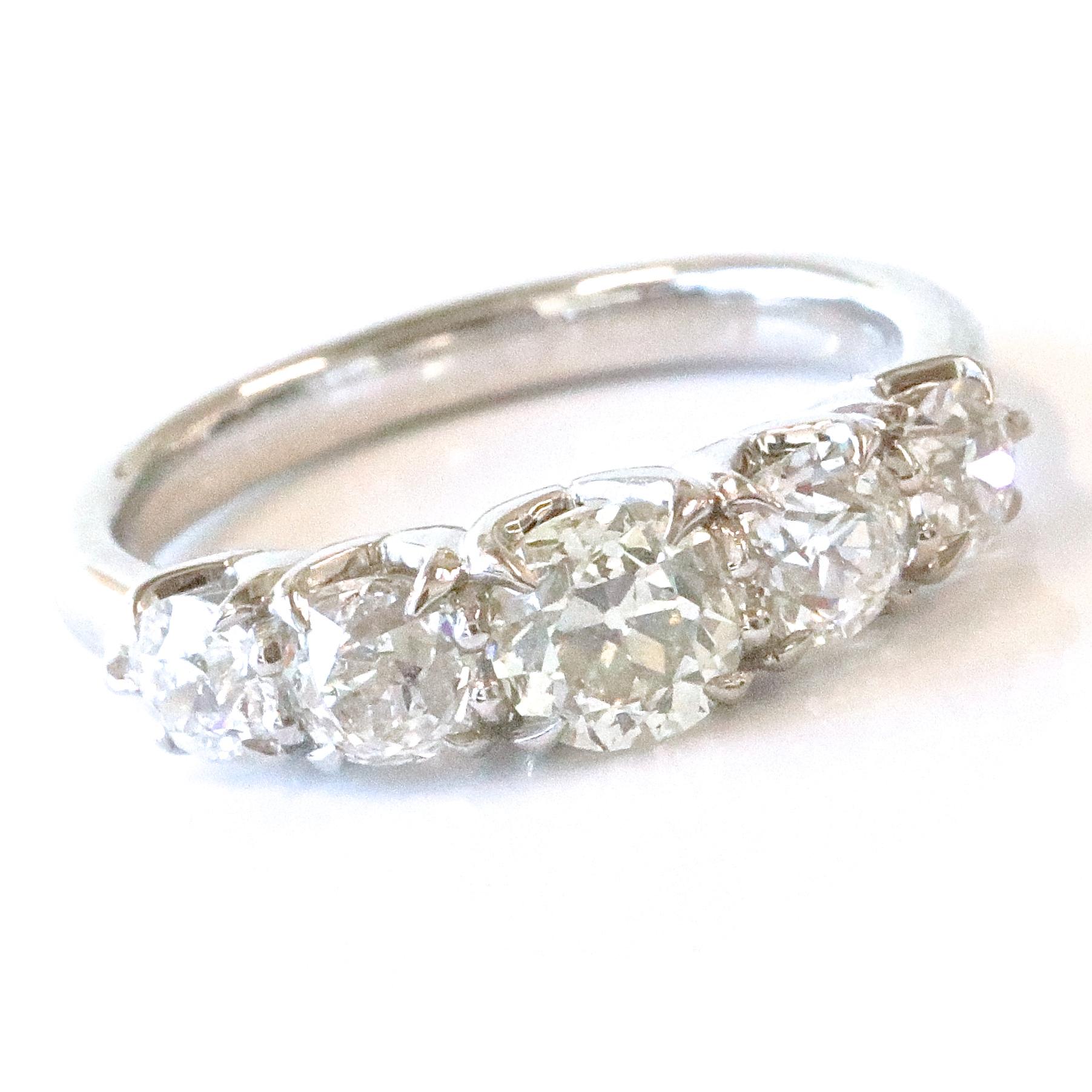 Stylish, modern and featuring antique diamonds. This gorgeous band can't get any better! Extremely comfortable and perfect for everyday wear, this band would make a wonderful wedding band or ring to stack with your other favorites. Featuring five