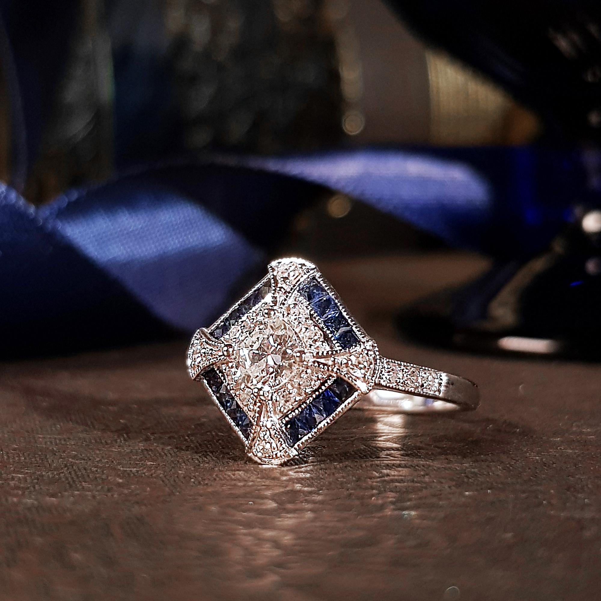 A fun ring with Art Deco inspire design. This 18k white gold diamond sapphire ring features old cut diamonds set in a square pattern, accented by single cut diamond and French cut sapphire and accented by fine milgrain detail. This is easy to wear