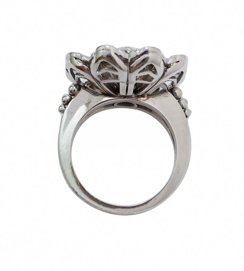 Elegant ring in 18 kt white gold structure mounted with a central diamond surrounded by a flower of diamonds . Externally, petals mounted with a diamond.
Old- Cut Diamonds 1.50 ct
Total Weight 12 gr
RF  +HHOH
K.ARUO
Italian Size 16
Usa Size