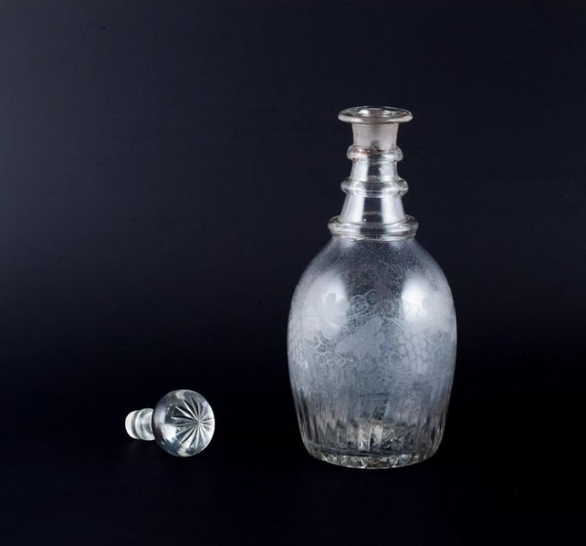 Old Danish wine carafe in mouth-blown glass engraved with grape clusters.
Late 19th century.
In excellent condition with lime deposits on the inside.
Dimensions: H 22.5 x D 8.0 cm.