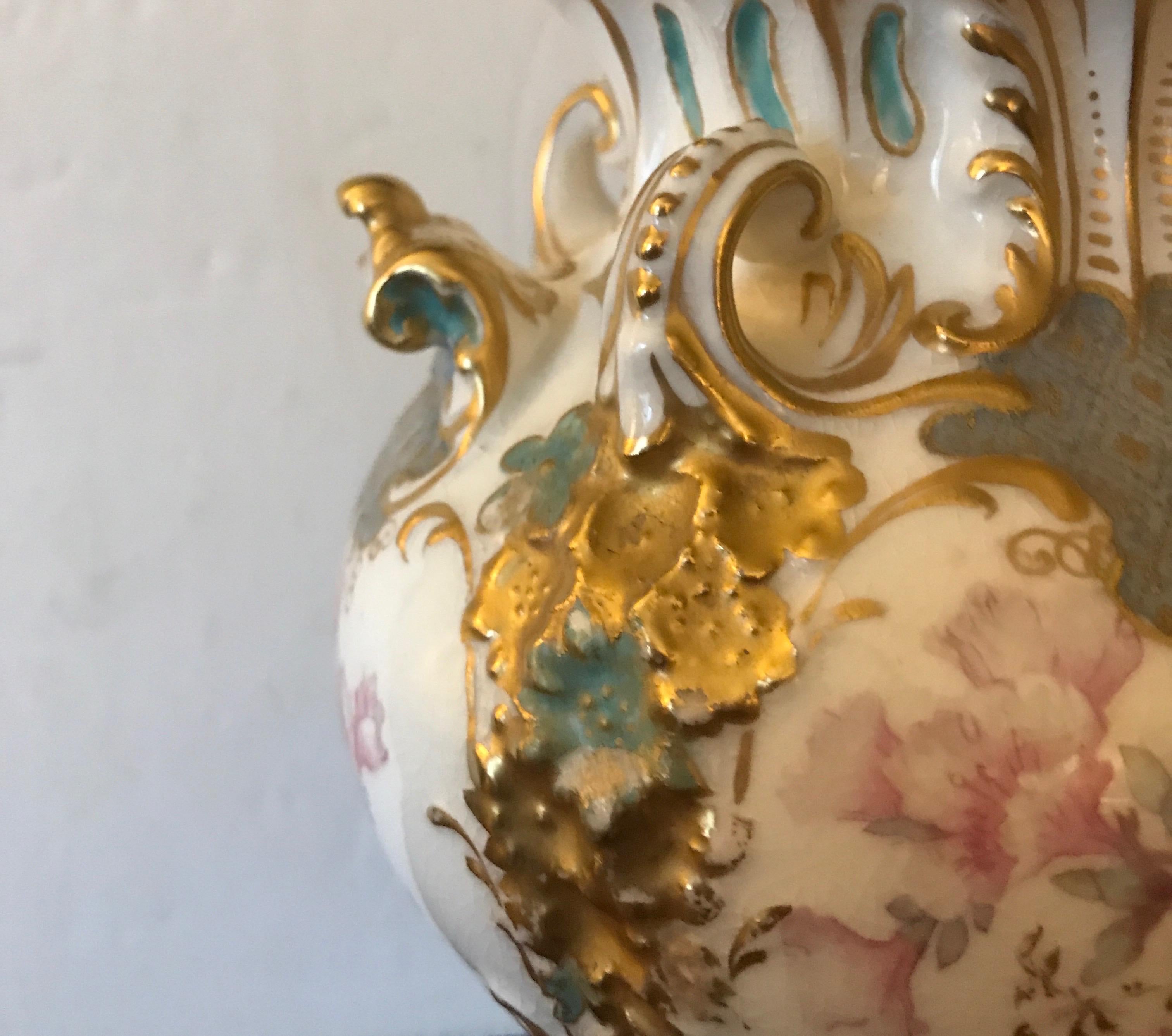 19th century English china vase with floral and gilt decoration,. Marked in red under-glaze with a crown and derby china in banner.