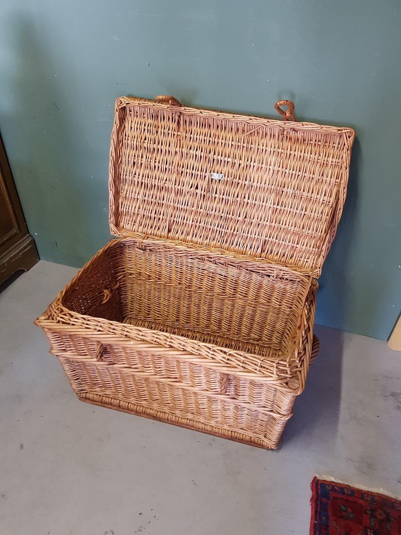 Old Dutch wicker basket and is marked by N.R.M. den Uijl Reed Furniture Hilversum, in a reasonable to good condition. Originating from the 1950s and 1960s.

The measurements are,
Depth 45 cm/ 17.7 inch.
Width 73 cm/ 28.7 inch.
Height 44 cm/