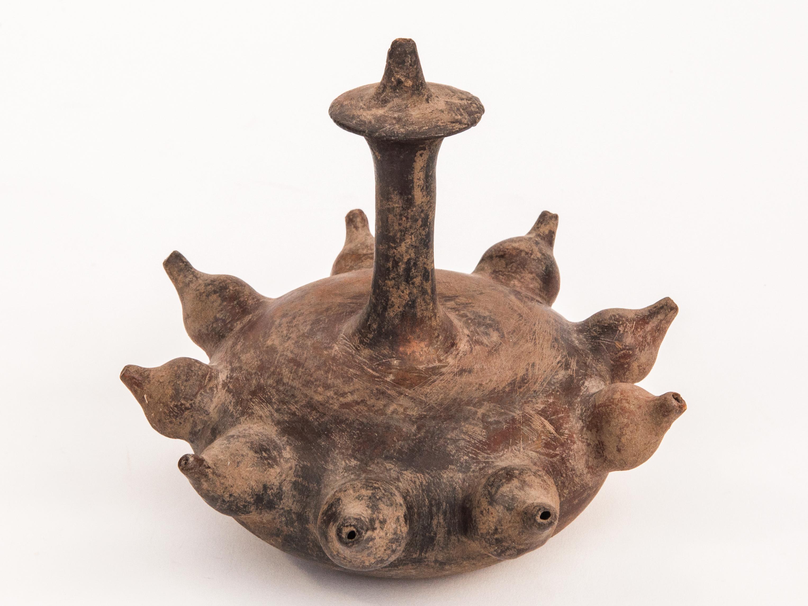 Old unglazed earthenware Kendi. Majapahit style. North or East Java. Late 19th century.
Kendi are pouring and drinking vessels found throughout Southeast Asia since ancient times, and were used in day to day life, as well as for ritual purposes. The