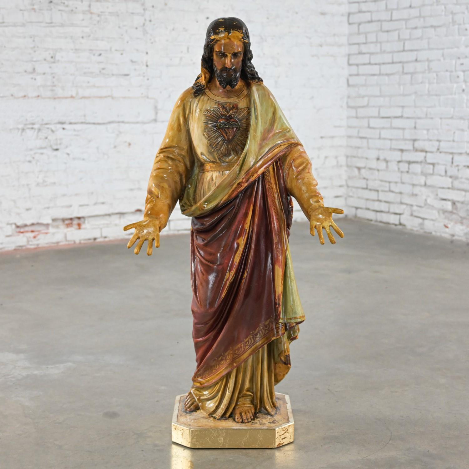 Glorious Late 19th to Early 20th Century Ecclesiastical Religious Art Sacred Heart of Jesus plaster statue sculpture upon a gilded wood base. Beautiful condition, keeping in mind that this is vintage and not new so will have signs of use and wear