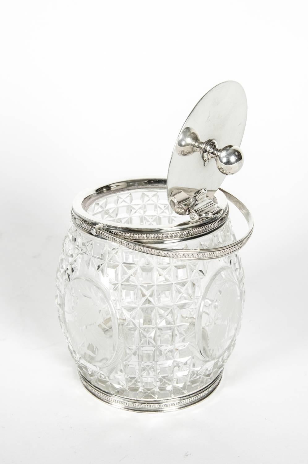 Old English cut crystal with silver plated covered ice bucket. The ice bucket open measure about 9 inches high x 6 inches diameter. Just exquisite and in excellent condition.
