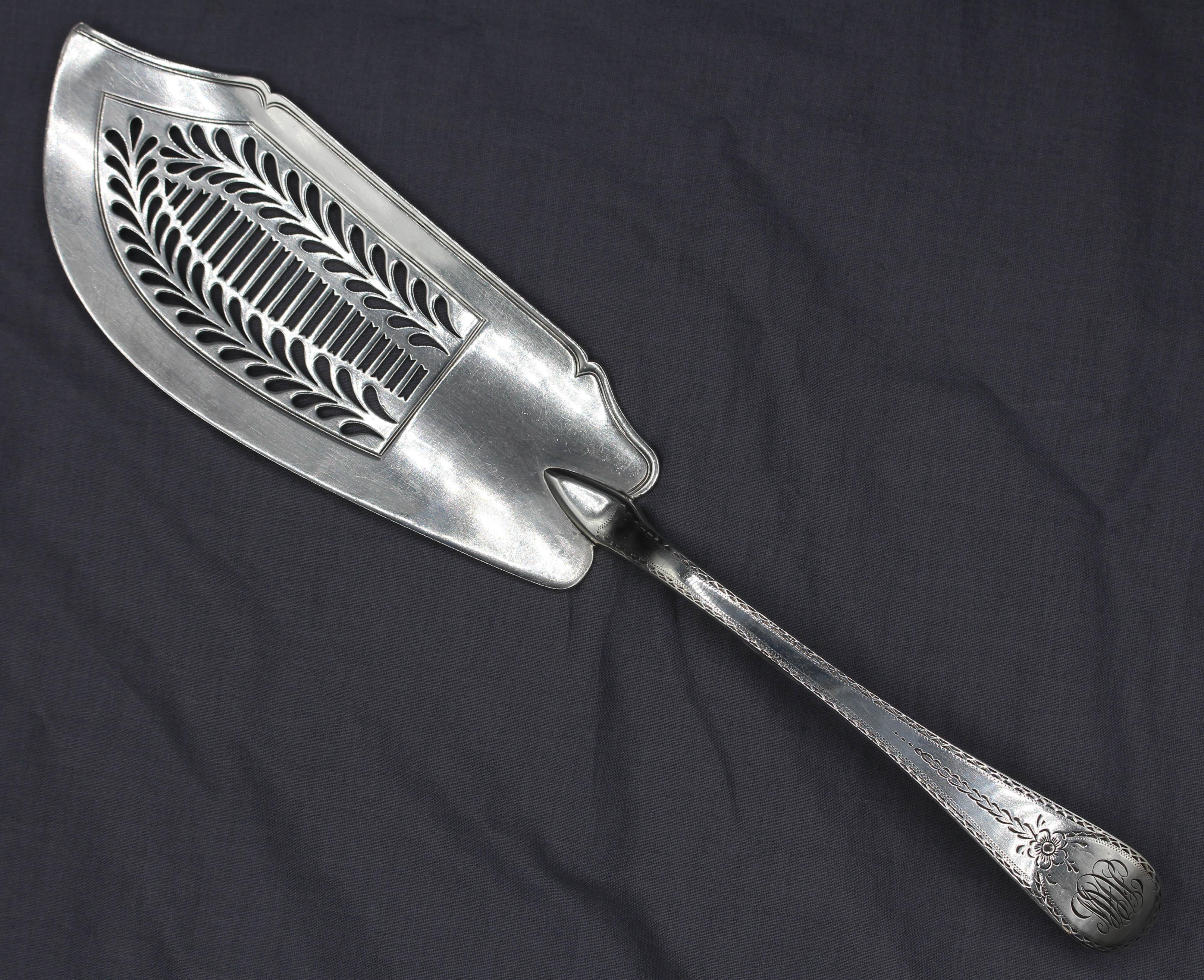 London, 1818, Old English engraved fish slice by William Eley I & William Fearn. Sterling silver; feather edge. Monogram of later date. 4.70 troy oz. 
Measurements: 12 3/8
