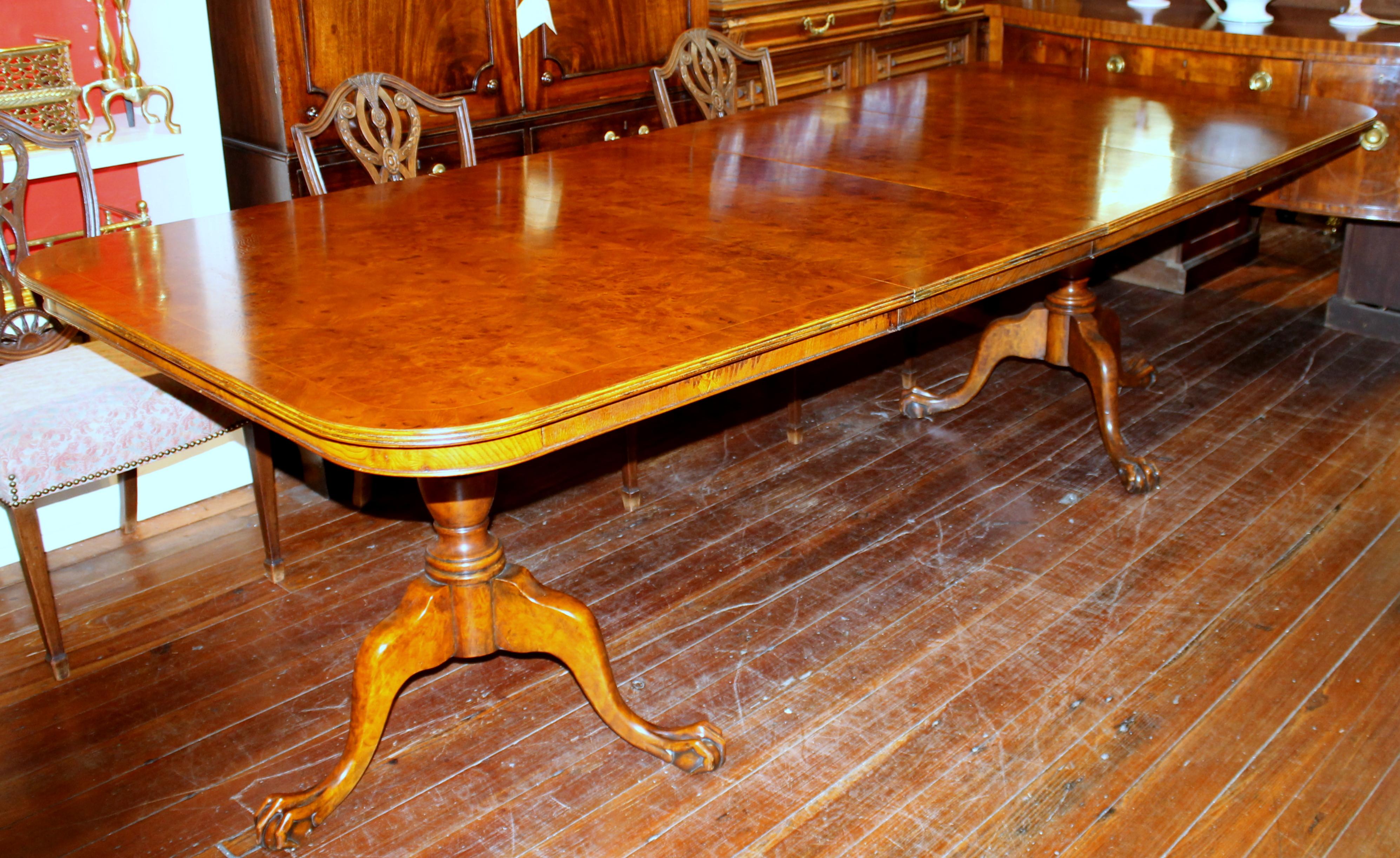 Fabulous Quality Old English Inlaid Book-matched Burr Walnut Chippendale Style Two Pedestal, Two Leaf Dining Table.  Exceptional highly figured veneers on top; figured apron all the way 'round.  Very Rare to find a table of this size in highly
