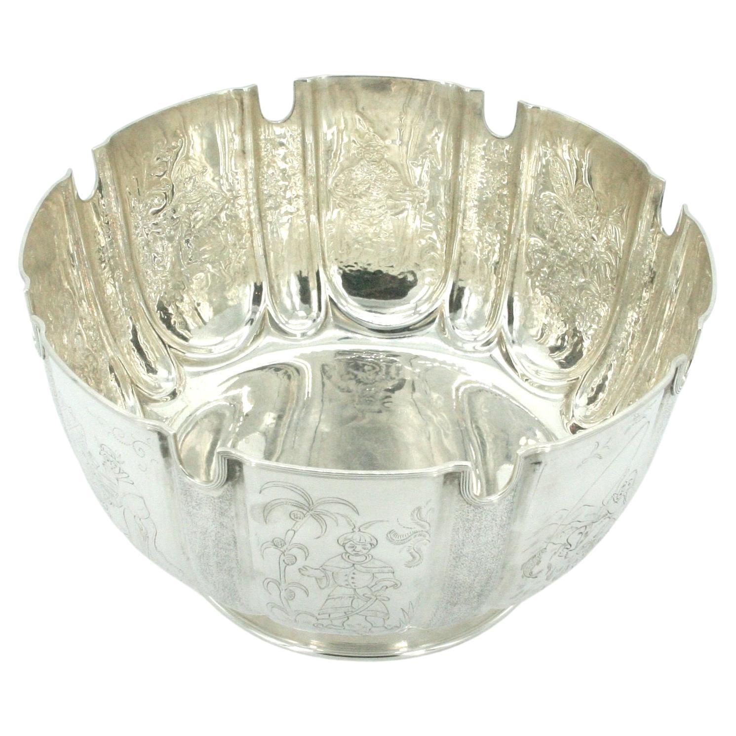 Old English sheffield silver plate tableware/barware centerpiece bowl . The centerpiece bowl features eight different exterior chinoiserie scene design details resting on a proportion round base. The bowl is in great condition. Maker's mark