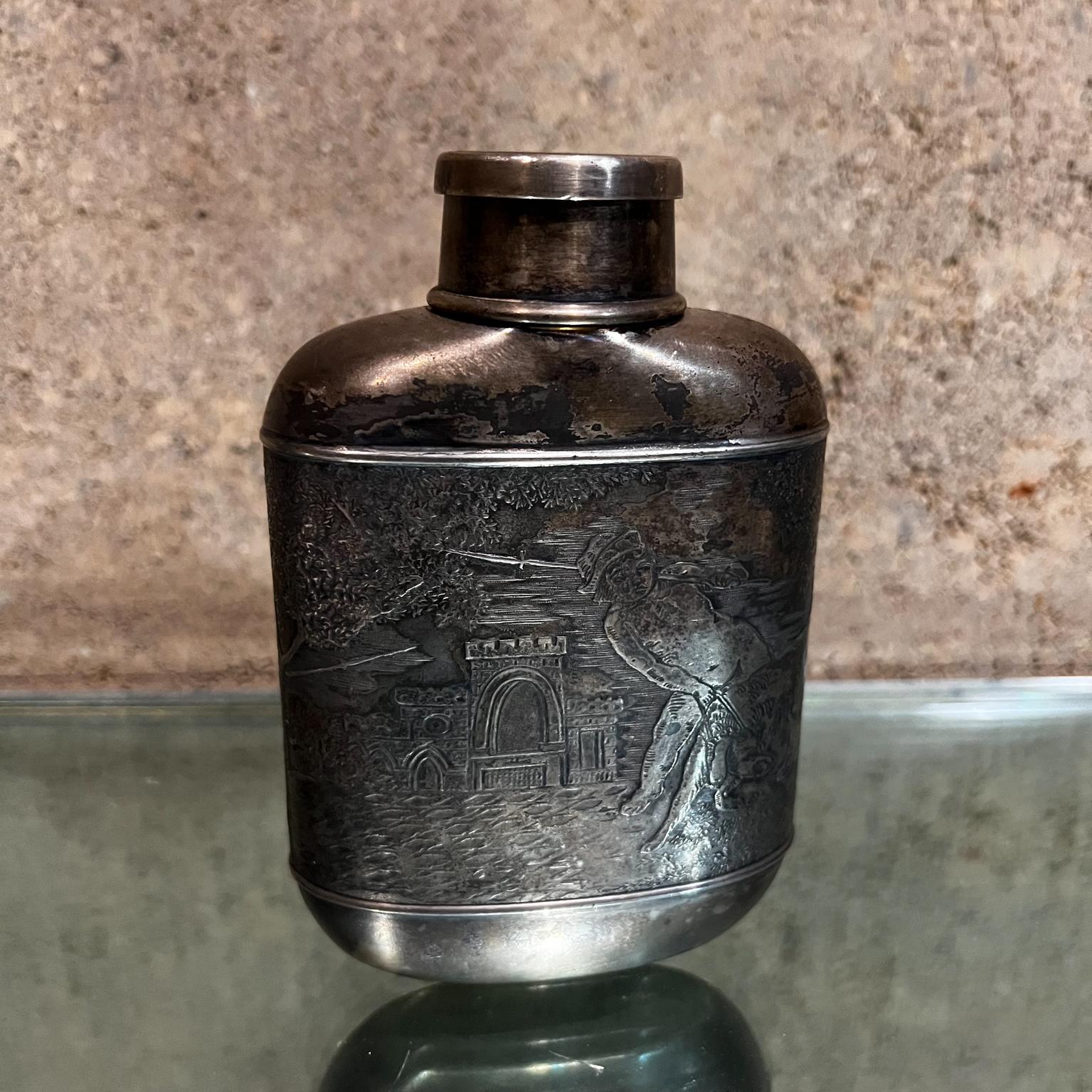 Old English silver liquor flask & cup figural relief hunting castle
Measures: 5.5 tall x 3.75 w x 1.5 d Cup 2.38 tall x 1.5 diameter
Drinking container screw cap serves as a cup.
Embossed graphics; kids on the field castles.
Preowned vintage
