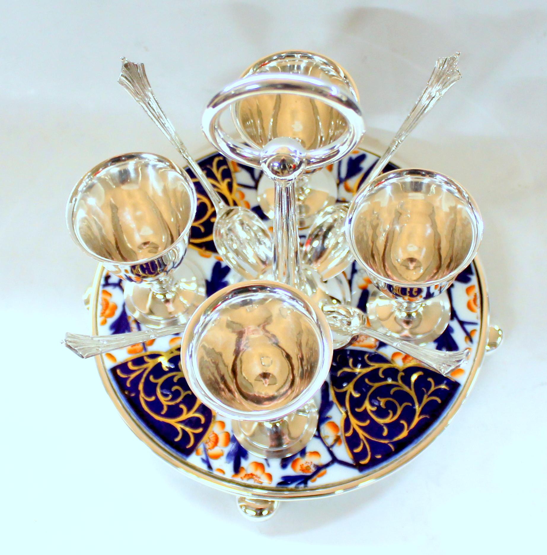 Very fine and rare old english silver plate egg cruet with spoons on an original imari porcelain base. Spoons are in the 