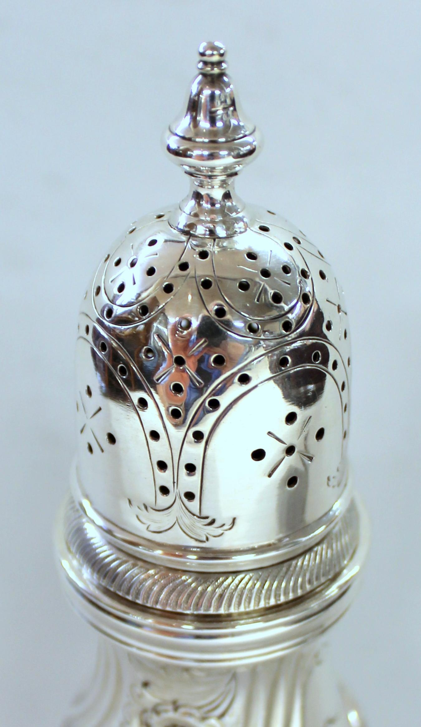 Very fine quality Old English silver plate hand chased sugar dredger, muffineer or shaker.
No apparent maker's marks found and tested for sterling, but tests silver plate. Exceptional hand-chasing.
to silver plate. Mint condition, no plate loss.