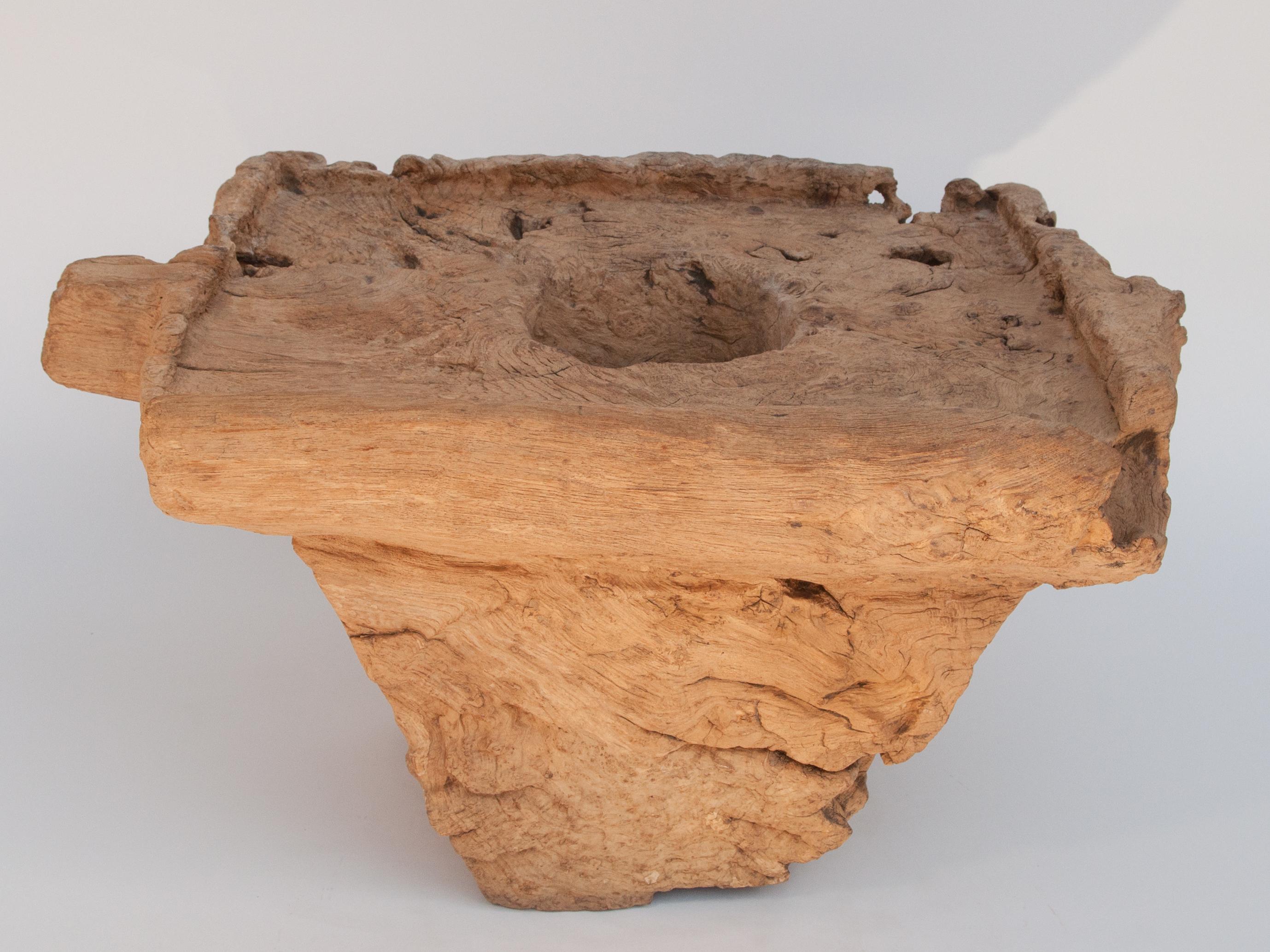 Old Eroded teak burl wood mortar with handle, North Thailand, mid-20th century.
This rustic mortar comes from rural northern Thailand where in its time it would have been used, together with a heavy wooden pounder, on an almost daily basis. This