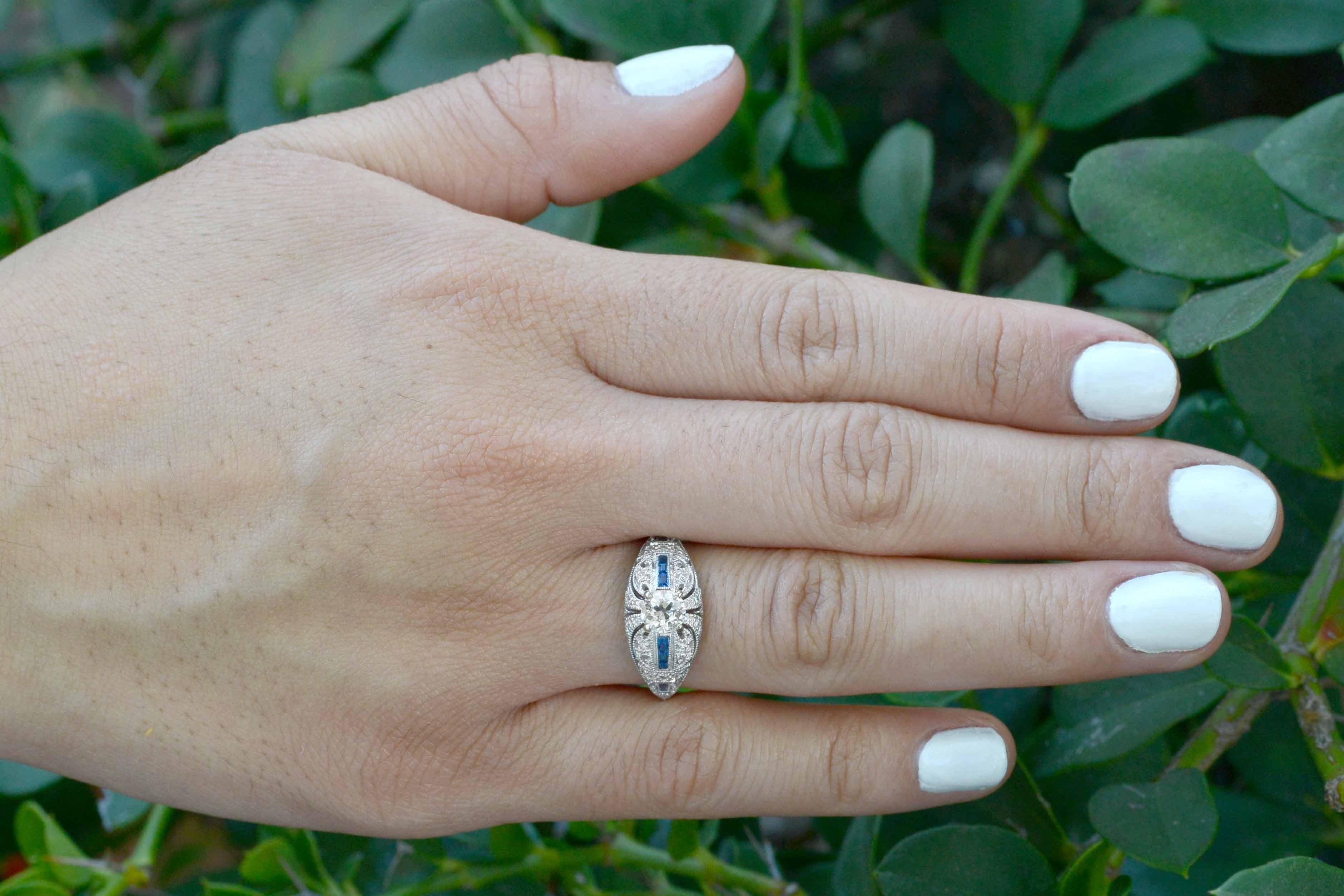 An alluring filigree dome style engagement ring centered by a fiery, old European brilliant 1/2 carat diamond. Nothing compares to the shine and sparkle of these hand cut 100 year old diamonds, reflecting light so differently than modern gems. Held