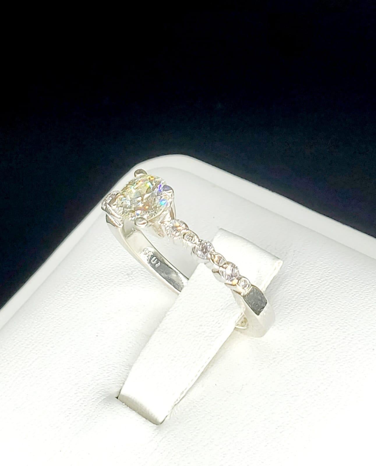 Old European Cut 0.70 Carat Round Diamond Ring 14k White Gold. Circa Art Deco 1950’s. Features 0.60 carat center diamond K/VS surrounded by 12 round cut diamonds totaling 0.10 carats. This ring shines and really sparkles from every angle. The ring
