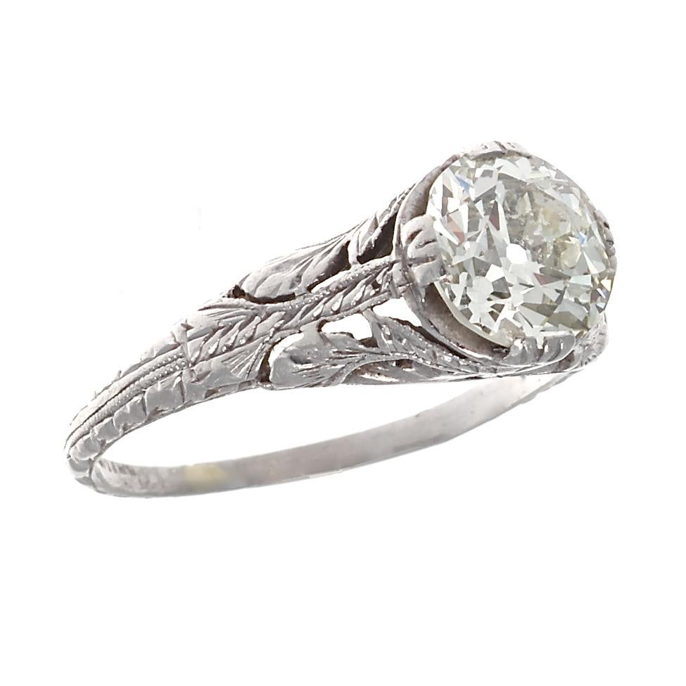 There's nothing like hand crafted filigree work, as seen in this 1 carat Art Deco platinum ring, featuring  an old European cut diamond, with J-K color and VS1-VS2 clarity. 
With floral designs beautifully carved into the tapered platinum band and