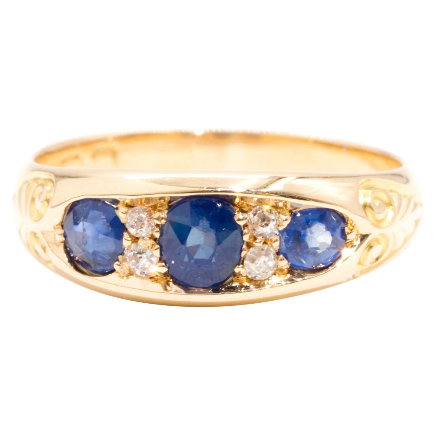 18 Karat Gelbgold Vintage Ring mit Diamant im alteuropäischen Schliff und blauem Saphir 