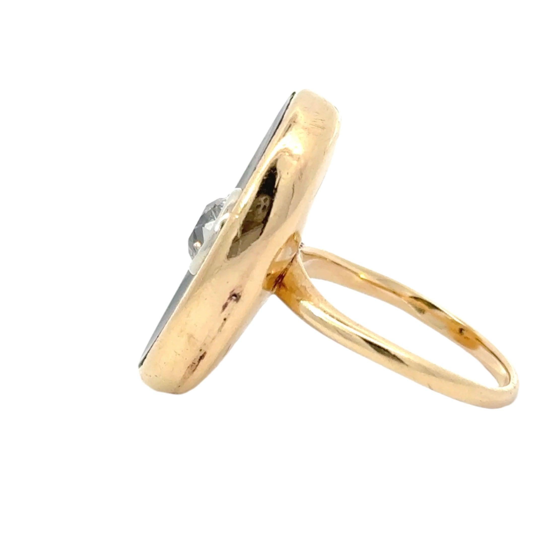 This vintage ring features a stunning half-carat old European cut diamond and black onyx, set in a 14K yellow gold band. Its art deco design adds a touch of timeless elegance to any outfit and makes it suitable for any occasion. The oval shape makes