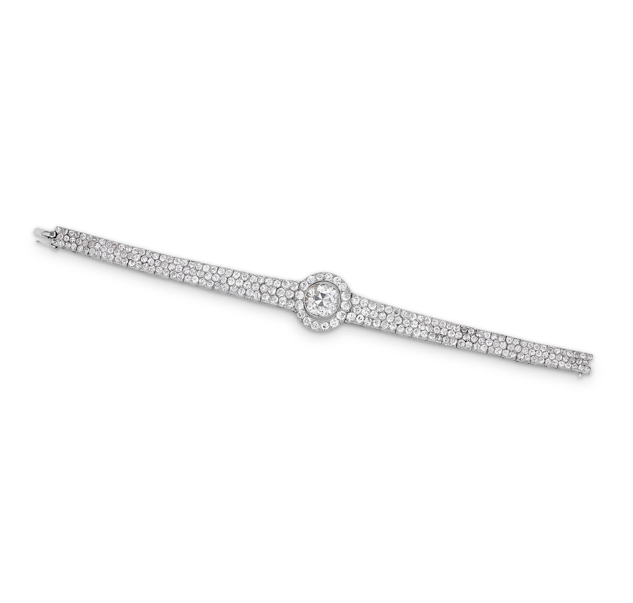 A stunning example of antique craftsmanship, this platinum bracelet features a central 6.08-carat old European cut diamond. The diamond captivates with its round, timeless brilliance. The bracelet is further accented by an additional 12.00 carats of