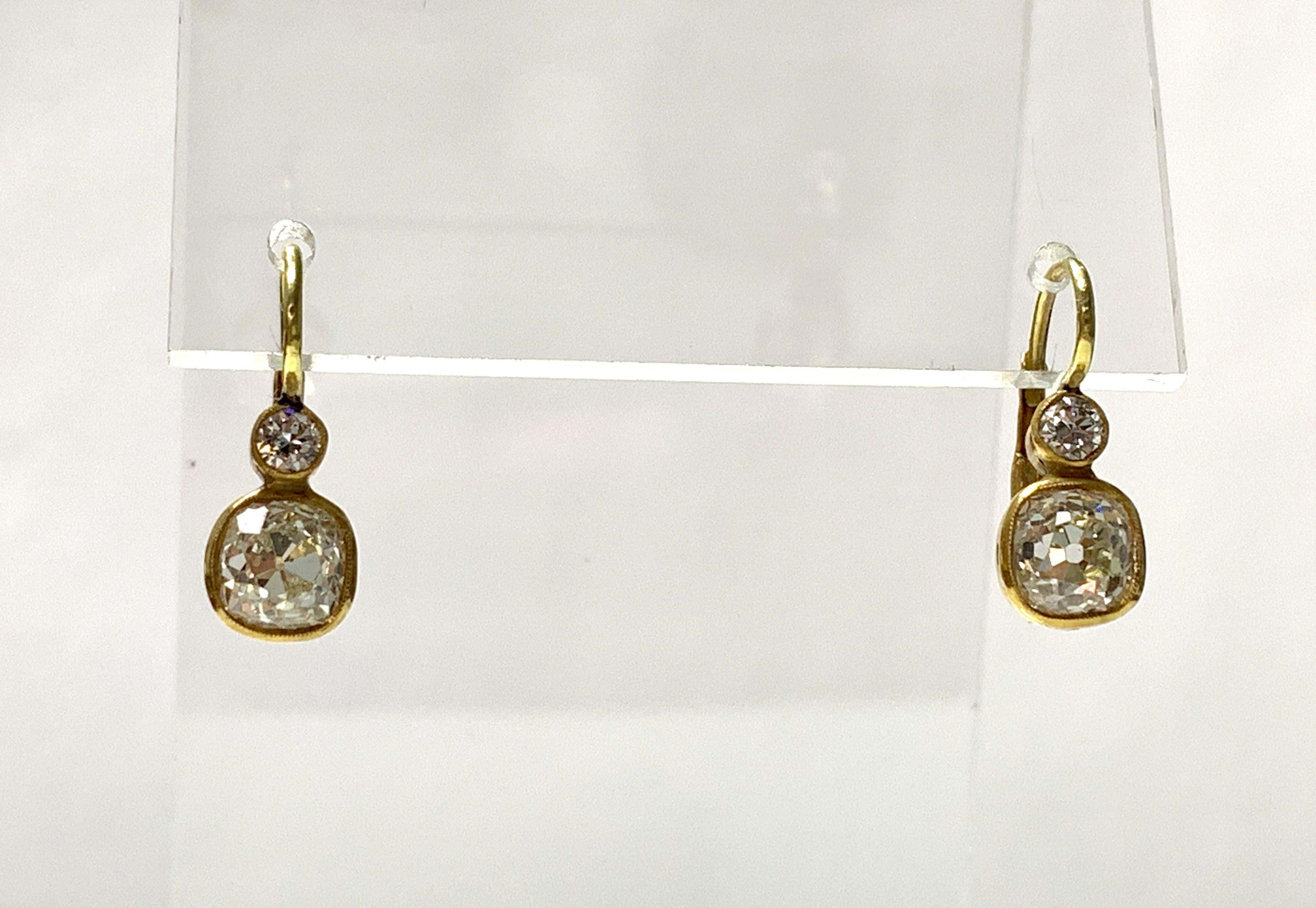 Elegant, Classy and beautiful Old Mine Cut dangle earrings in 18k yellow gold. 
The details are as follows : 
Diamond weight : 2.80 carat ( big pair ) ( LM color and VS clarity ) 
Diamond weight : 0.20 carat ( small pair ) ( LM color and VS clarity