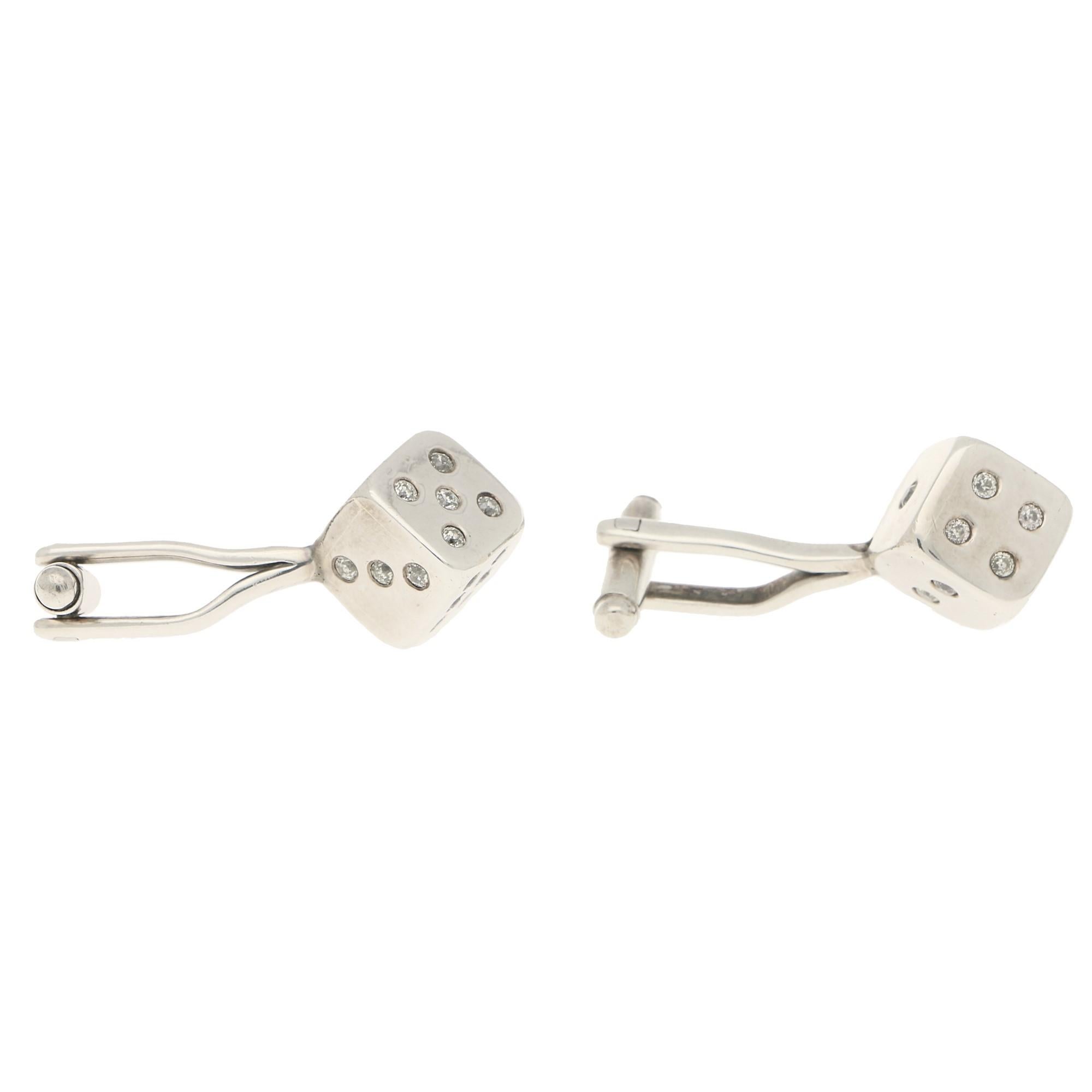 A beautiful pair of 1950's diamond set dice swivel back cufflinks in white gold.

Each cufflink depicts a 6 sided dice with each side being set with an array of old European cut diamonds. The cufflinks are beautifully detailed and the diamonds make