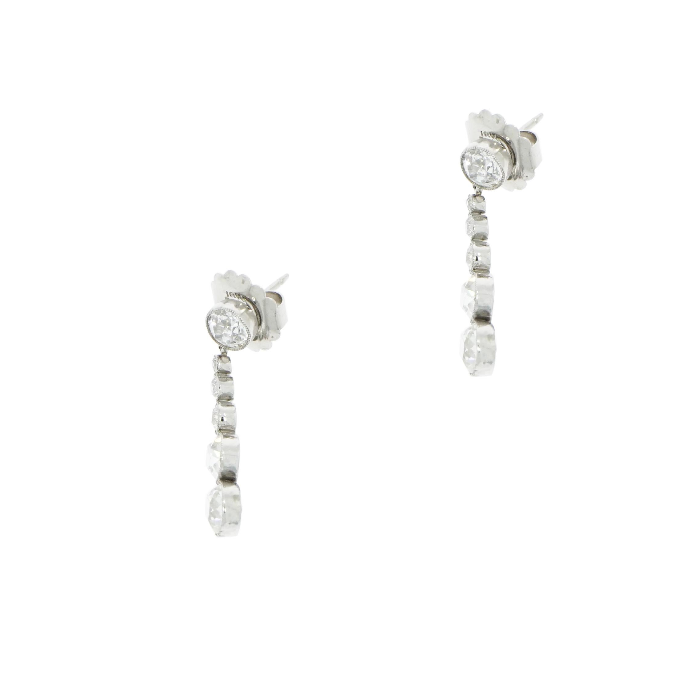 This is a very special turn of the century original handmade circa 1900-1910 bright and sparkly Old European cut Diamond drop earrings. Edwardian Deco design with Victorian influence.
These earrings are comprised of 6 Graduated Old European cut