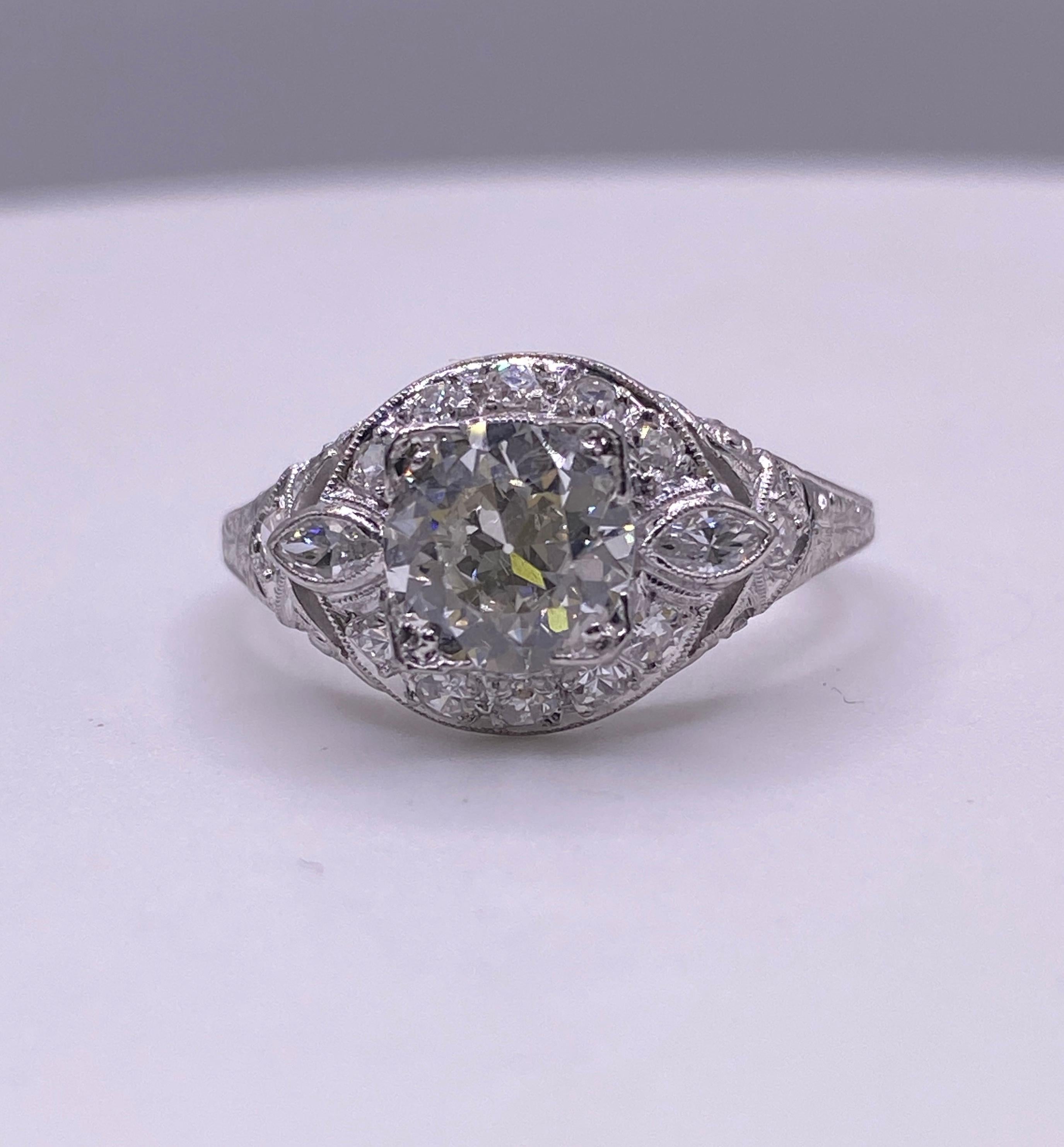 900 Platinum engagement ring with 1.19 carat J/Vs1 Old European Cut center diamond and 10=.4 carat total weight setting diamonds. RAP $5088. Size 7.75 US