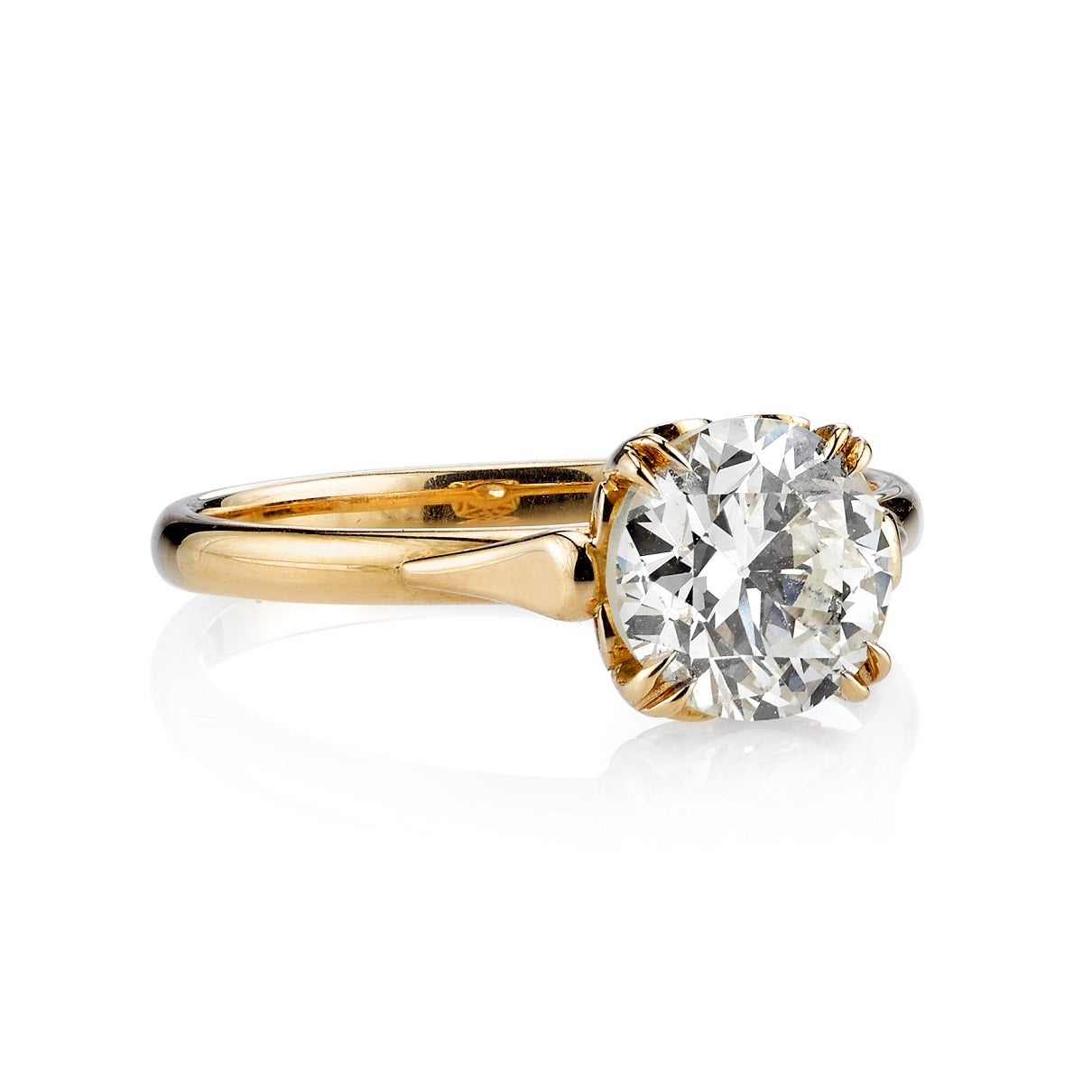 1.57ct N/VS old European cut diamond set in a handcrafted 18K yellow gold mounting. A classic solitaire design that features a intricate gallery.
