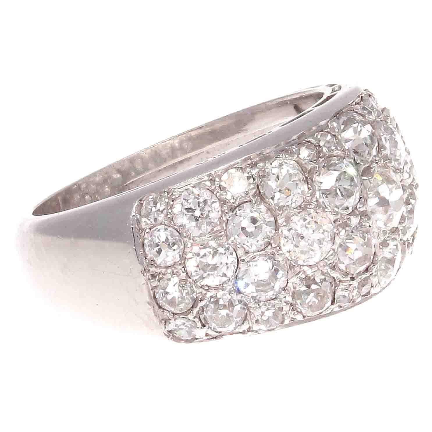 True elegance through pure design. Featuring an array of old European cut diamonds weighing approximately 3.50 carats that are G-H color, SI+ clarity. All expertly embedded in the hand crafted platinum ring.

Ring size 8-1/2 and can easily be