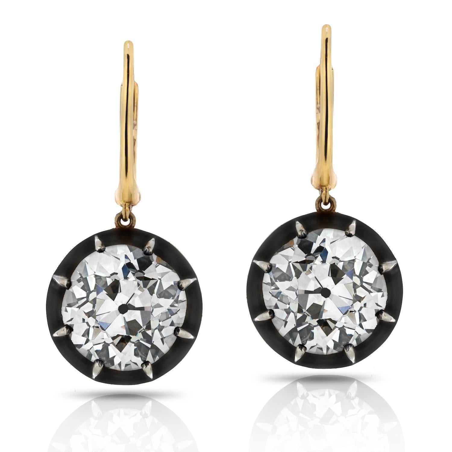 Indulge in the allure of vintage elegance with our exquisite 18k Yellow Gold & Silver Drop Diamond Earrings. These stunning earrings are a true testament to timeless beauty and exceptional craftsmanship, featuring Old European cut diamonds that