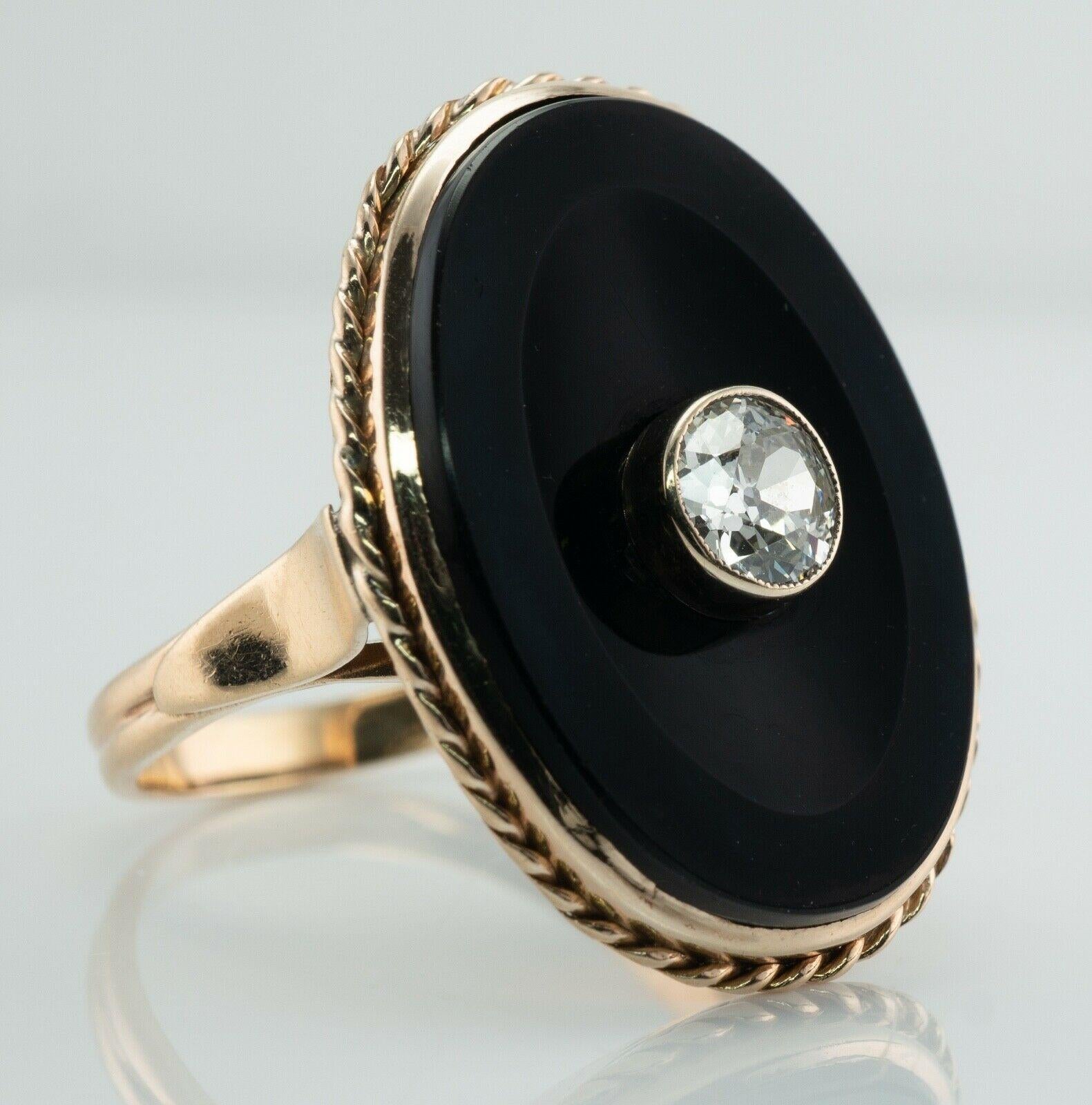 This vintage circa 1940s ring is made in solid 14K Yellow Gold. 
The center Old European cut diamond is .75 carat of SI1 clarity and H color. 
The Onyx has minor signs of wear. The tiny scratches cannot be seen without a significant magnification.