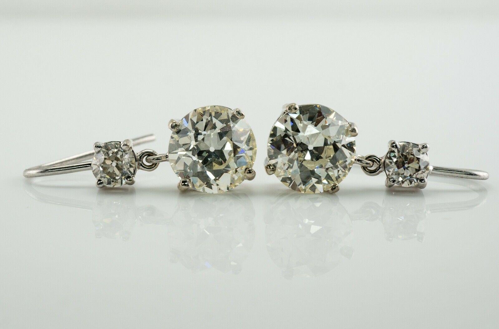Old European Cut Diamond Earrings 18K White Gold 4.37 TDW

This absolutely stunning pair of vintage earrings is crated in solid 18K White gold (carefully tested and guaranteed). Total weight for two bottom European cut diamond is 3.87 carat, two