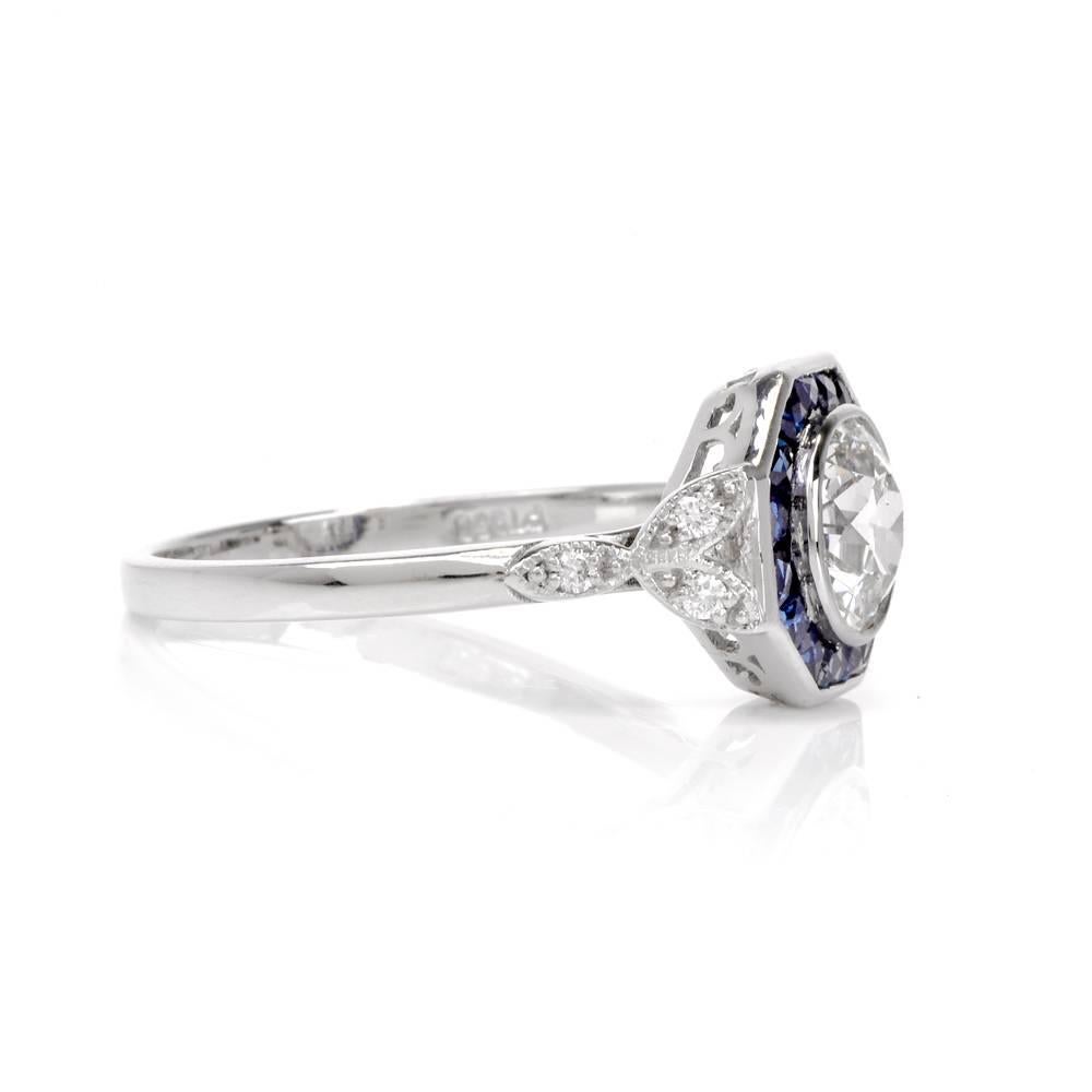 This Art Deco Style engagement ring is crafted in solid platinum and weighs approx. 3.7 grams. It centered with one high grade genuine Old European-cut diamond approx. 0.95 carats, graded G-H color and VS1 clarity is surrounded by an enchanting