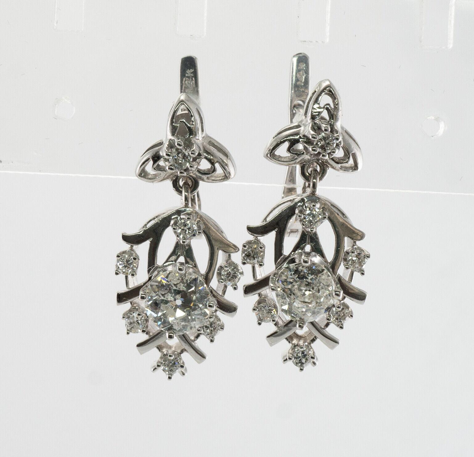 Boucles d'oreilles composées de diamants européens anciens Or blanc 14K Dangle floral 2.36 TDW

Ces magnifiques boucles d'oreilles vintage sont fabriquées en or blanc massif 14K et serties de diamants naturels. Le diamant central de taille