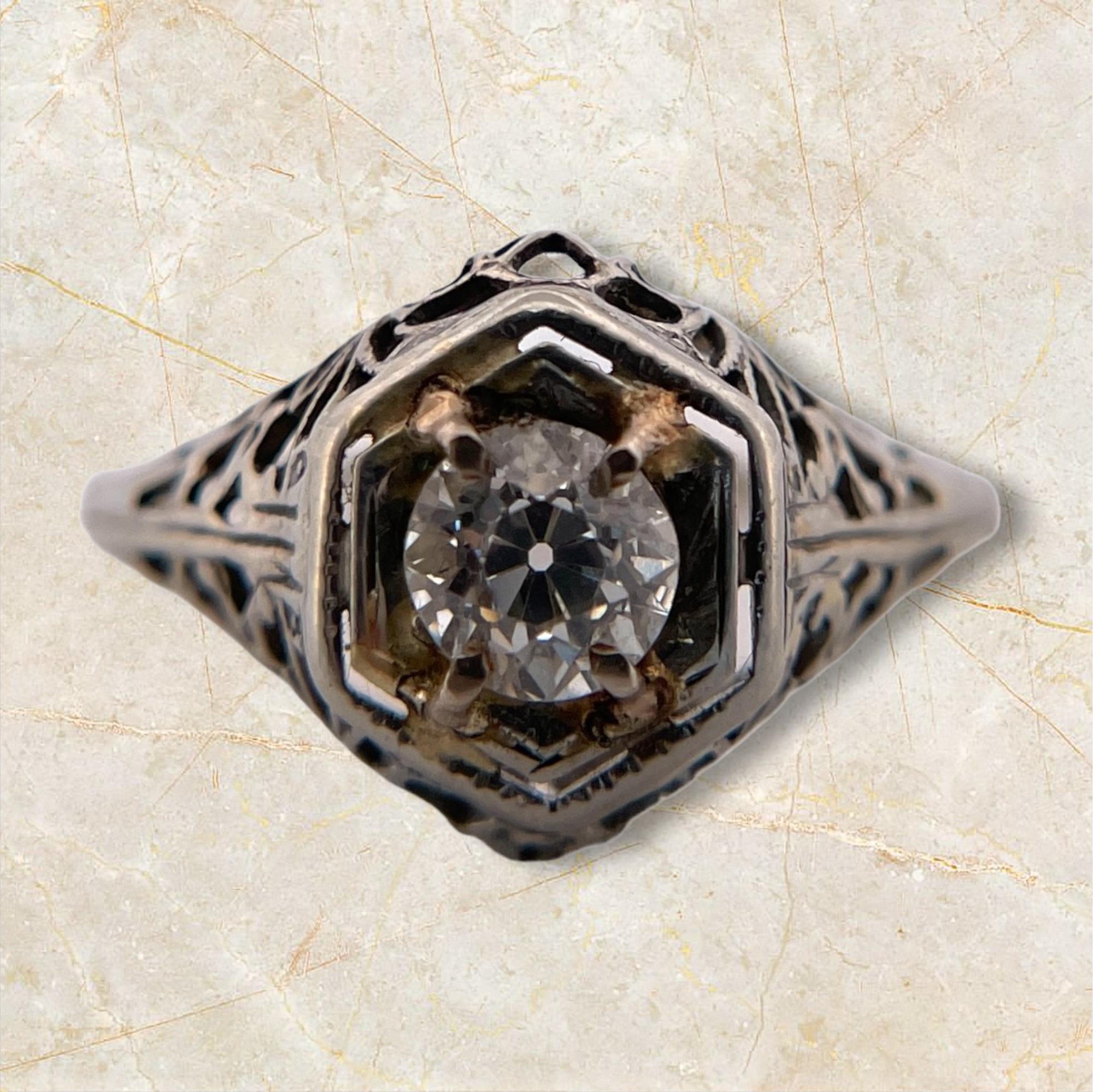Discover timeless elegance with this Old European Filigree Diamond Ring. Featuring a 0.46 carat diamond, this ring showcases intricate filigree detailing that exudes vintage charm. Perfect for those who appreciate the beauty of classic craftsmanship