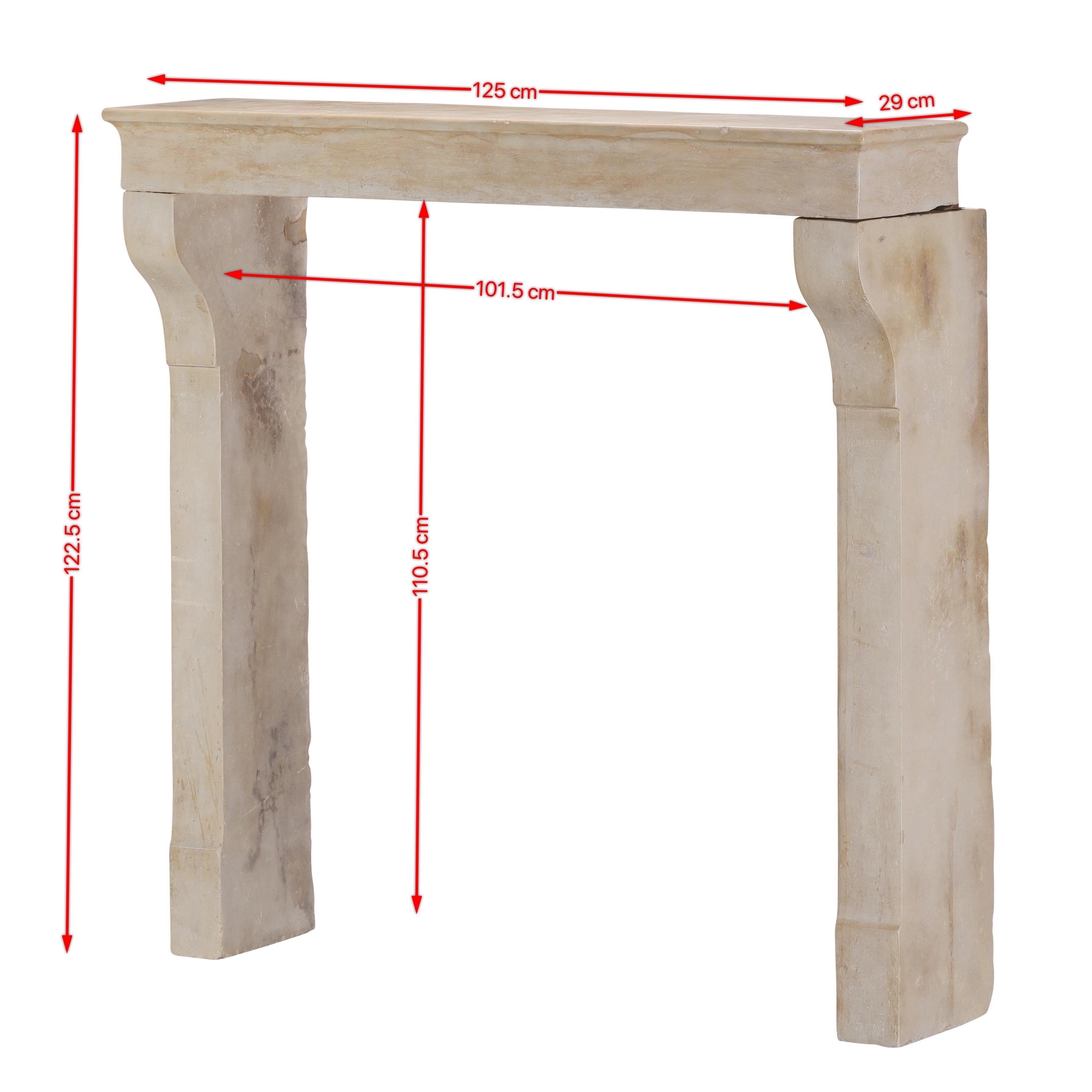 This authentic 19th-century French fireplace surround is a testament to the elegant simplicity of classic architectural forms.
Carved in fine limestone, the surround features clean proportions, with soft curves where the uprights meet the lintel and