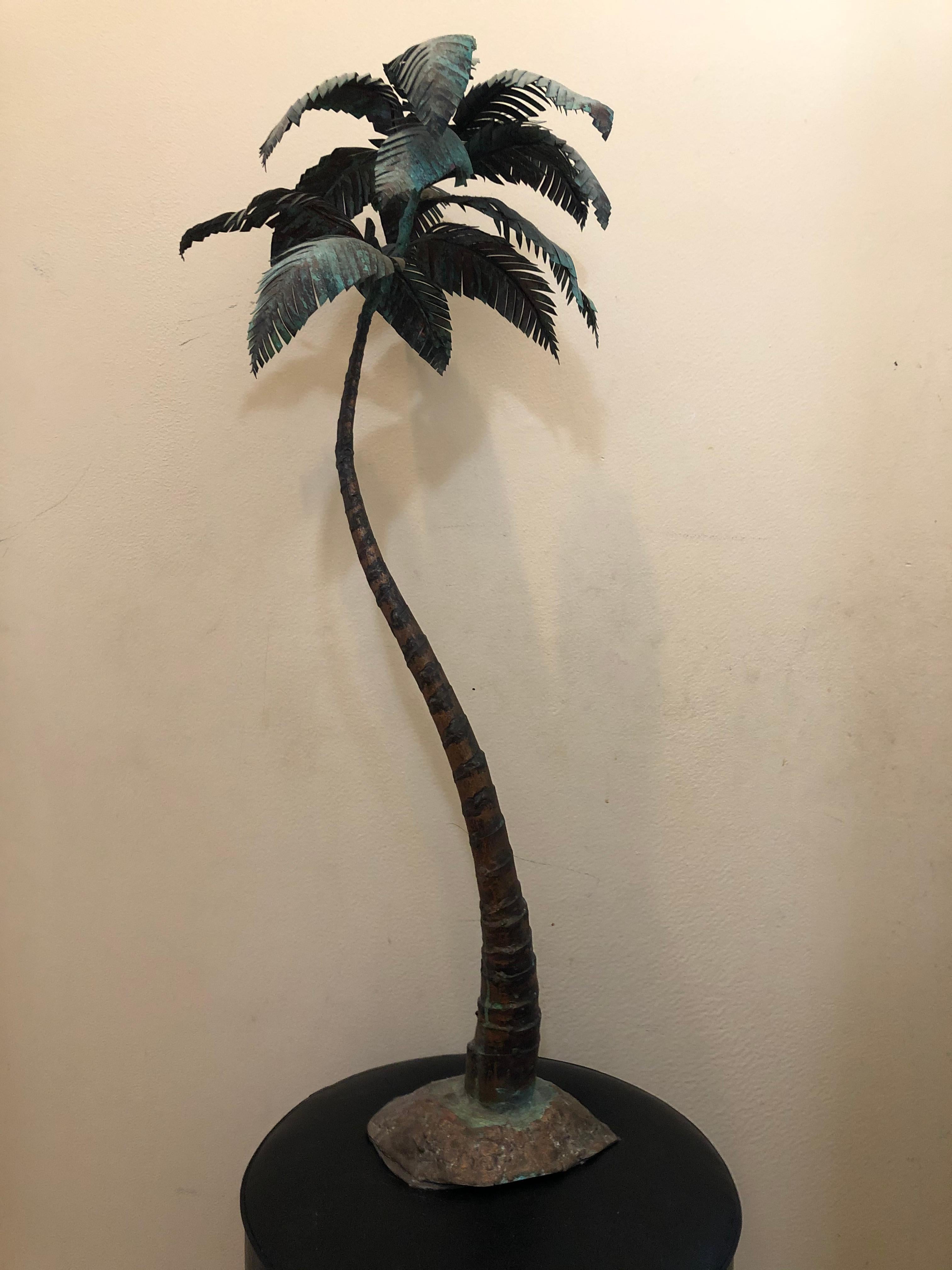Incredibly detailed one of a kind Palm Tree sculpture. It is made from bronze and copper. Magnificent patina. It stands 34 inches high. The base is 9 inches wide and the trunk of tree measures 2 1/2 inches wide. In over 40 years of buying and